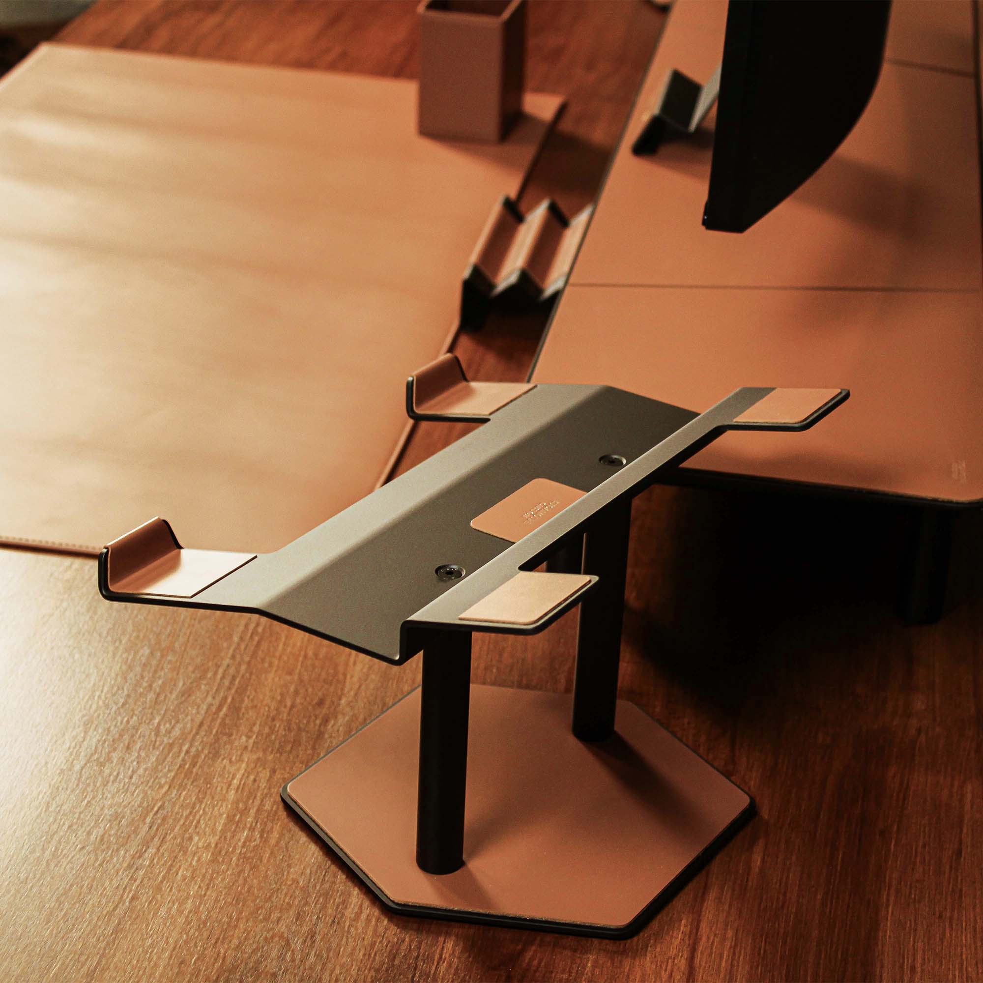 Lifestyle setup featuring the chestnut laptop riser with matching accessories