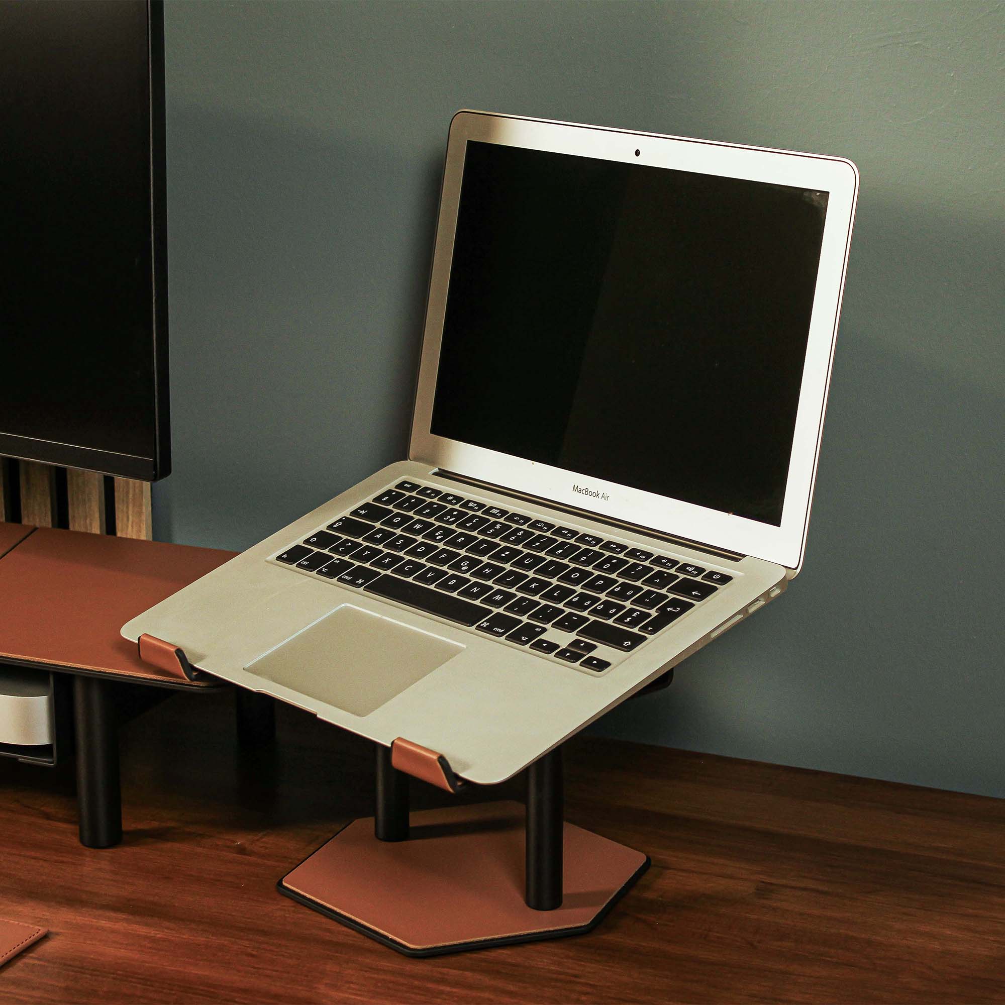 Lifestyle setup featuring the chestnut laptop riser with matching accessories