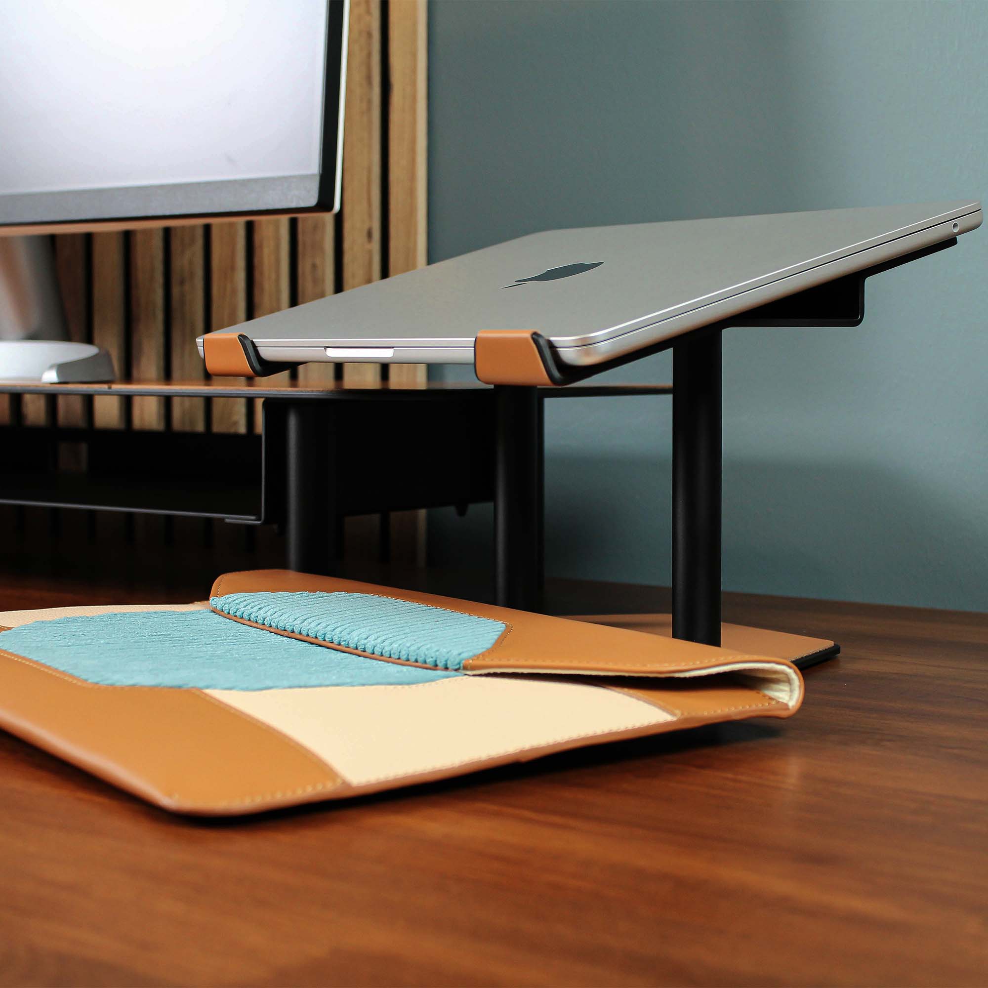 Lifestyle setup featuring the cognac laptop riser with matching accessories