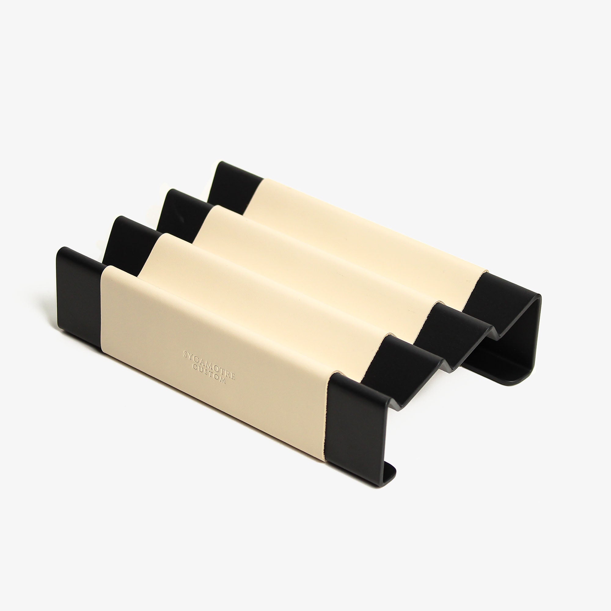 Side angle showing the depth and detail of the beige pen tray