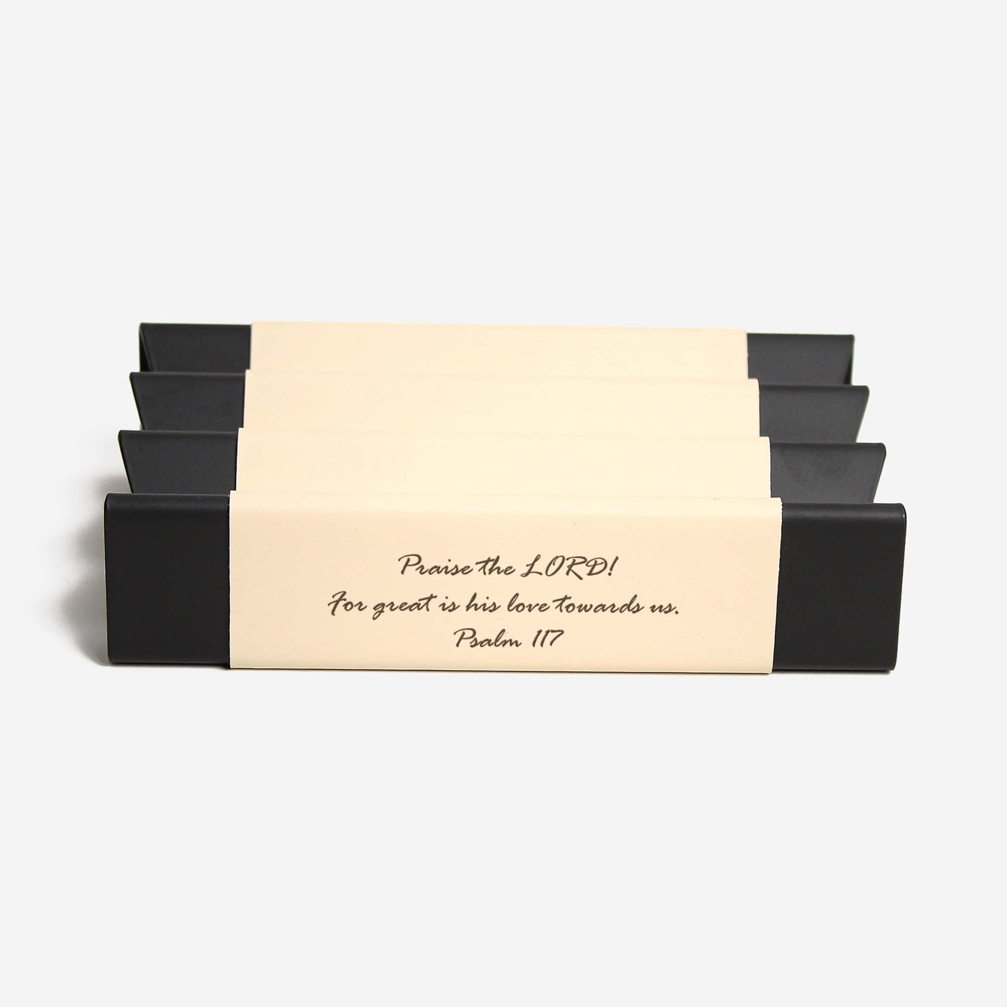 Close-up of the padded base of the beige pen tray for surface protection