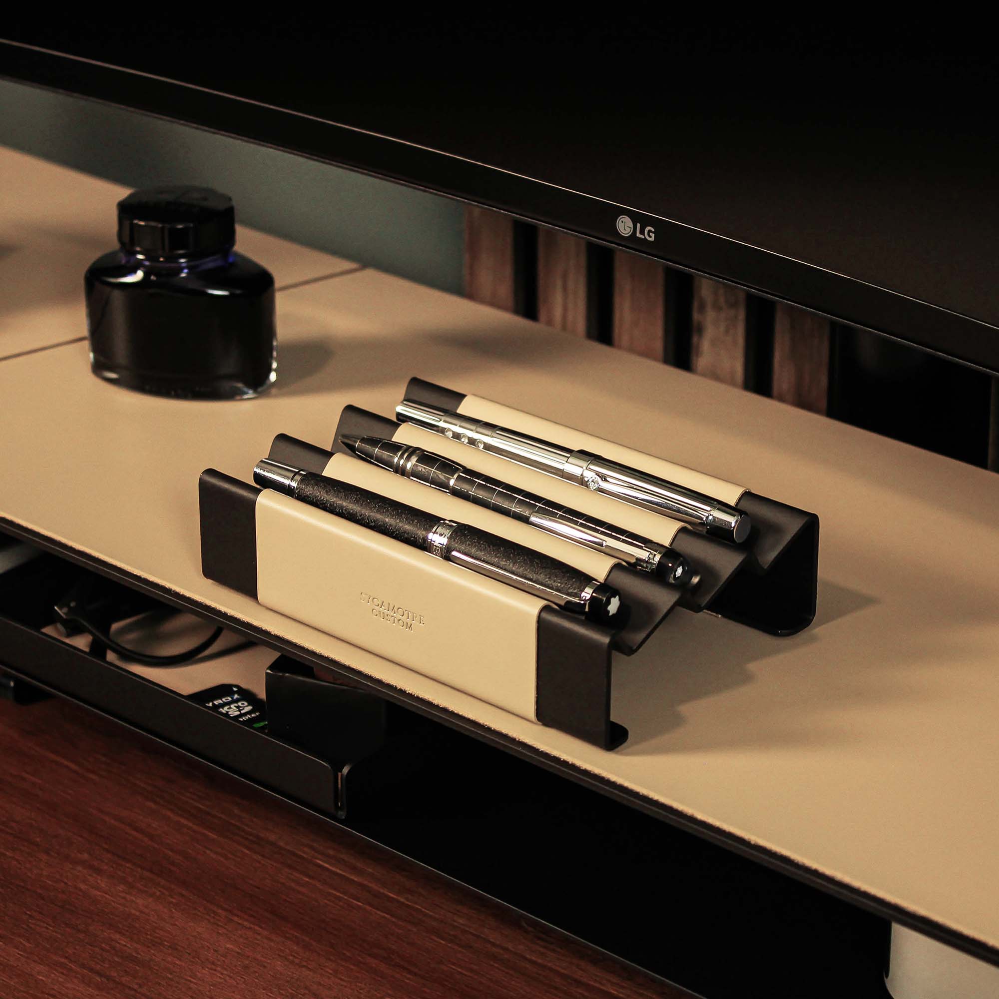 Minimalist workspace setup featuring the latte pen tray