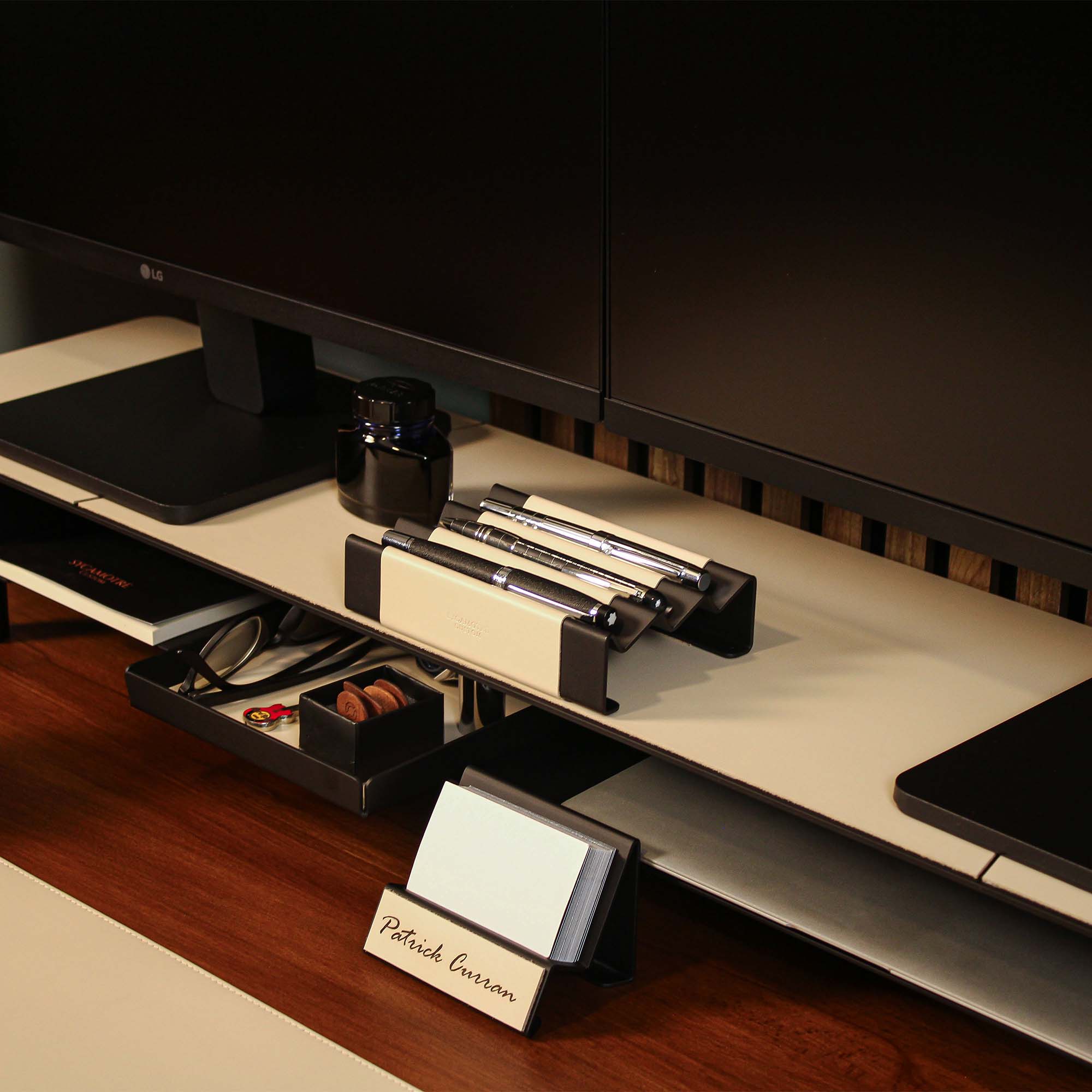 Minimalist workspace setup featuring the beige pen tray