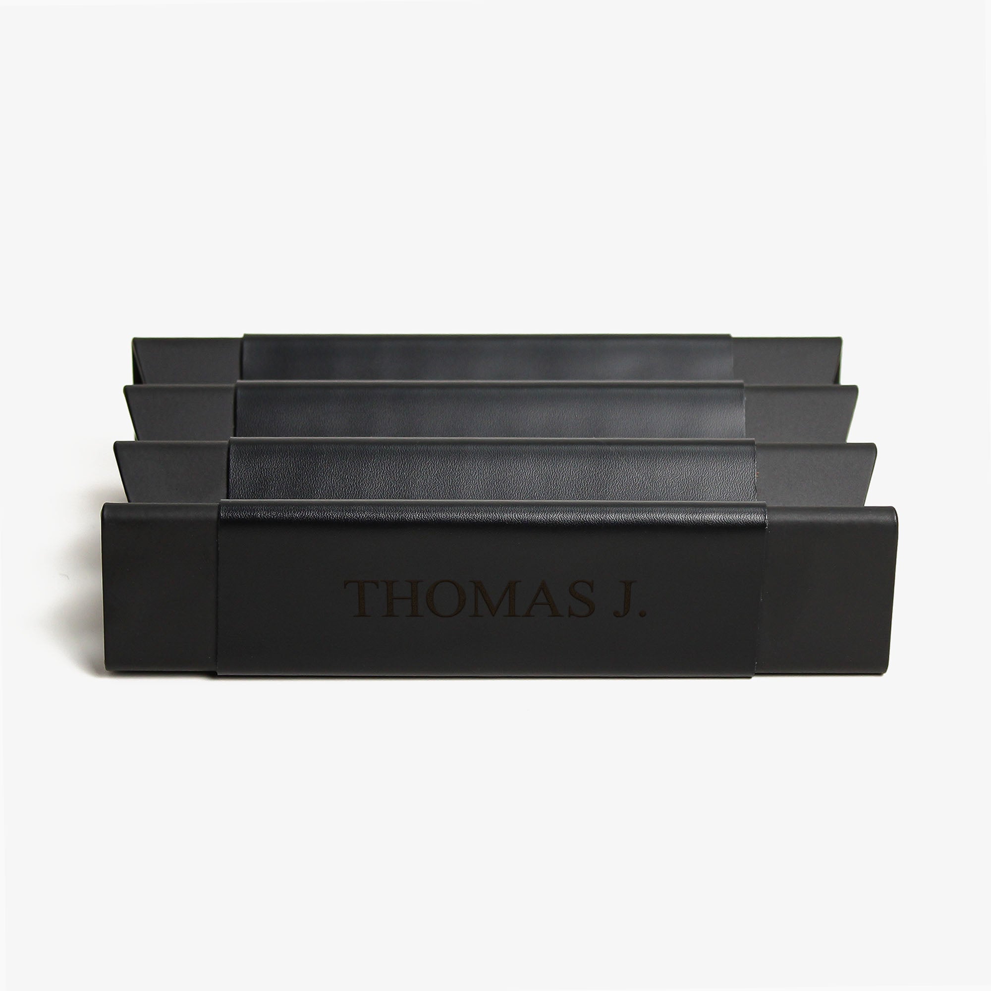 Close-up of the padded base of the black pen tray for surface protection