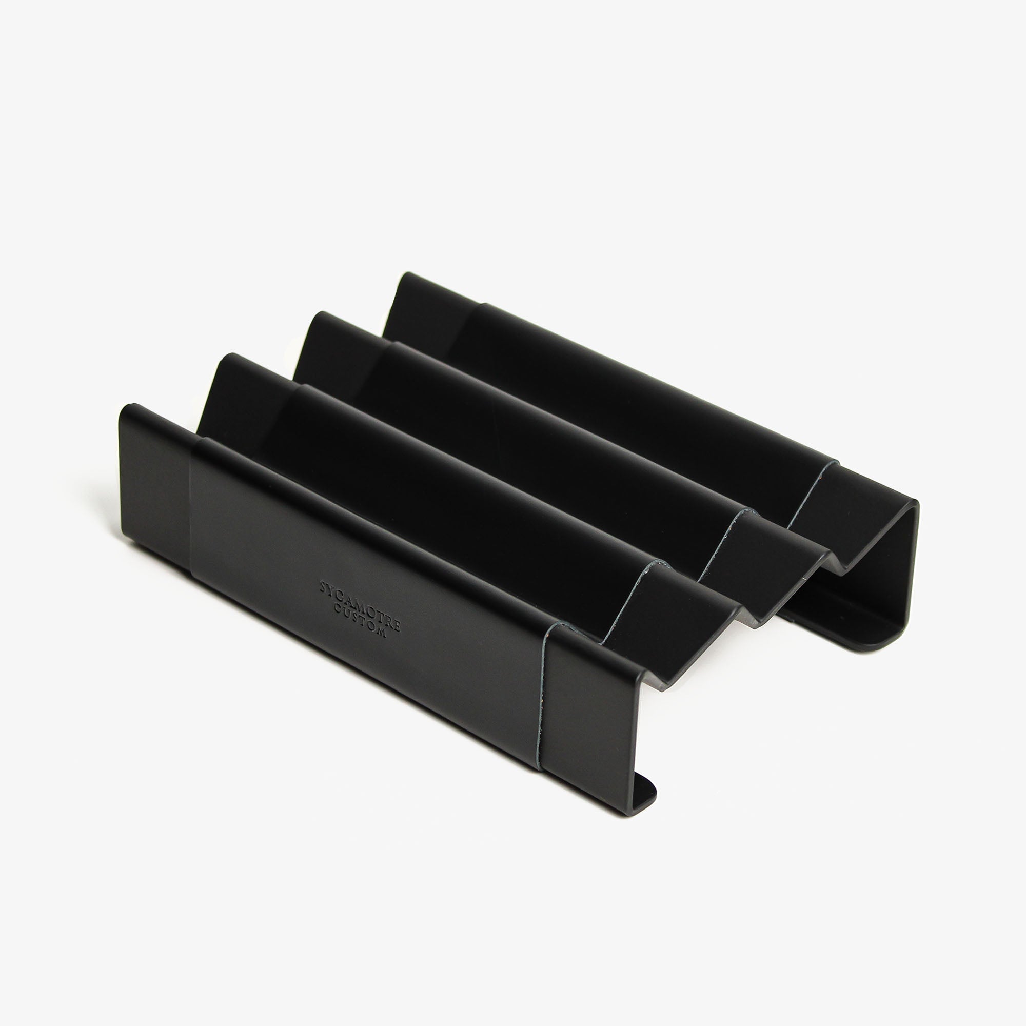 Side angle showing the depth and detail of the black pen tray