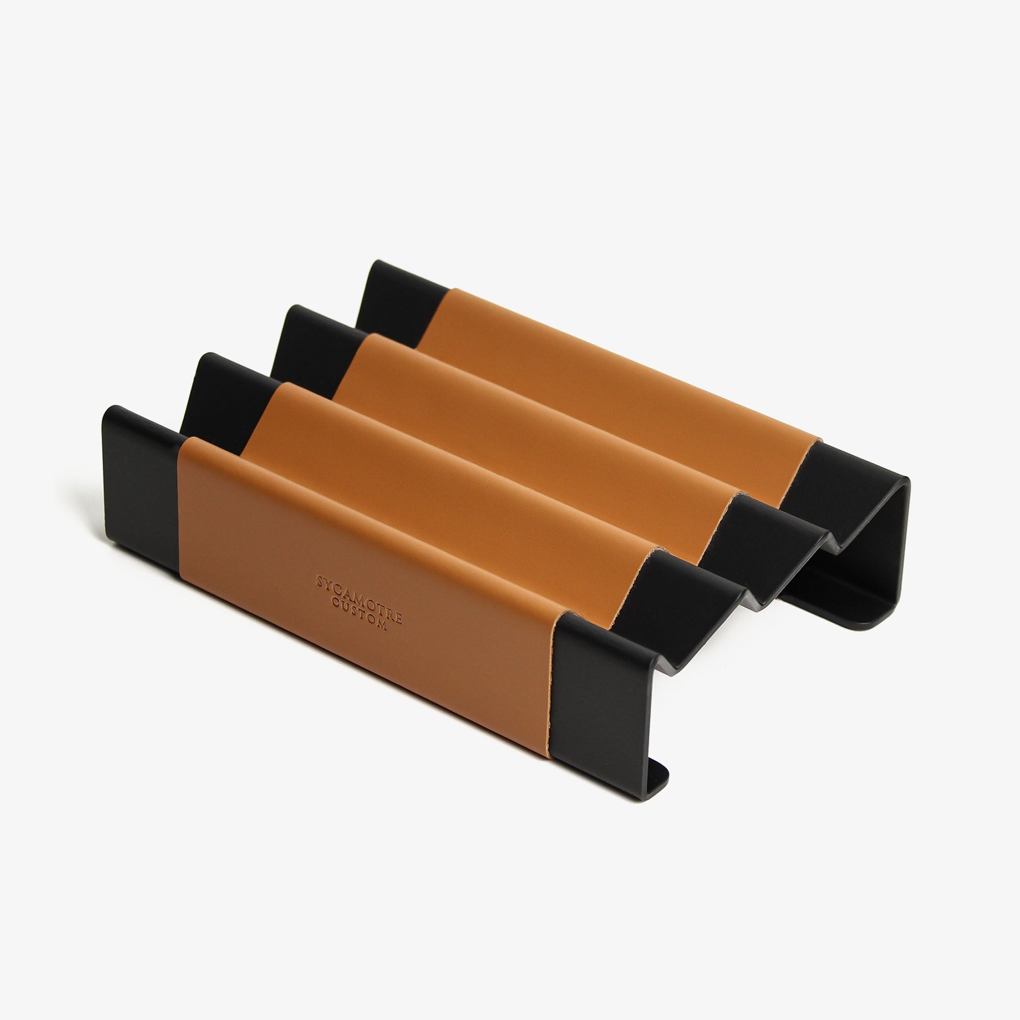 Side angle showing the depth and detail of the cognac pen tray