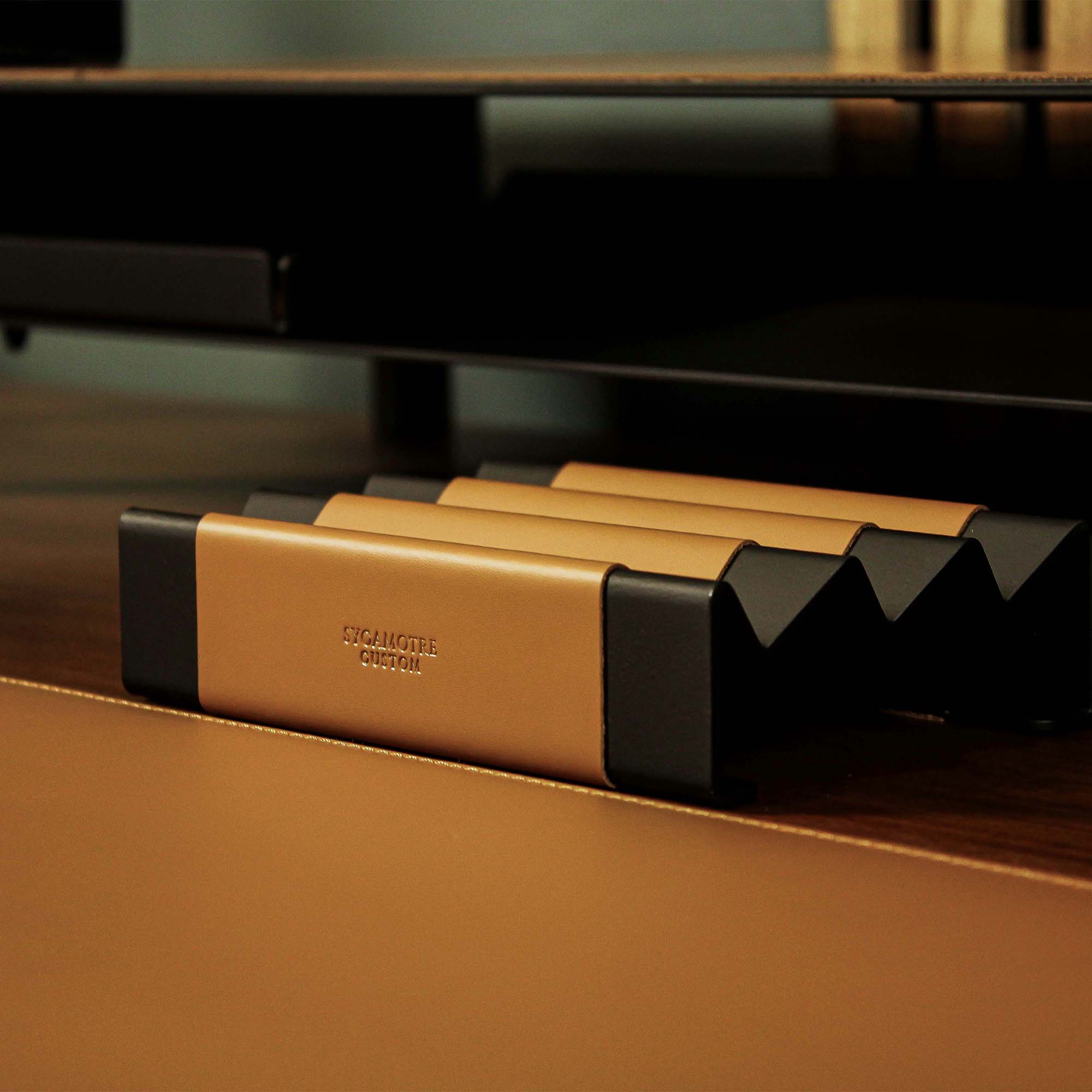 Front view showing the shape and finish of the cognac pen tray