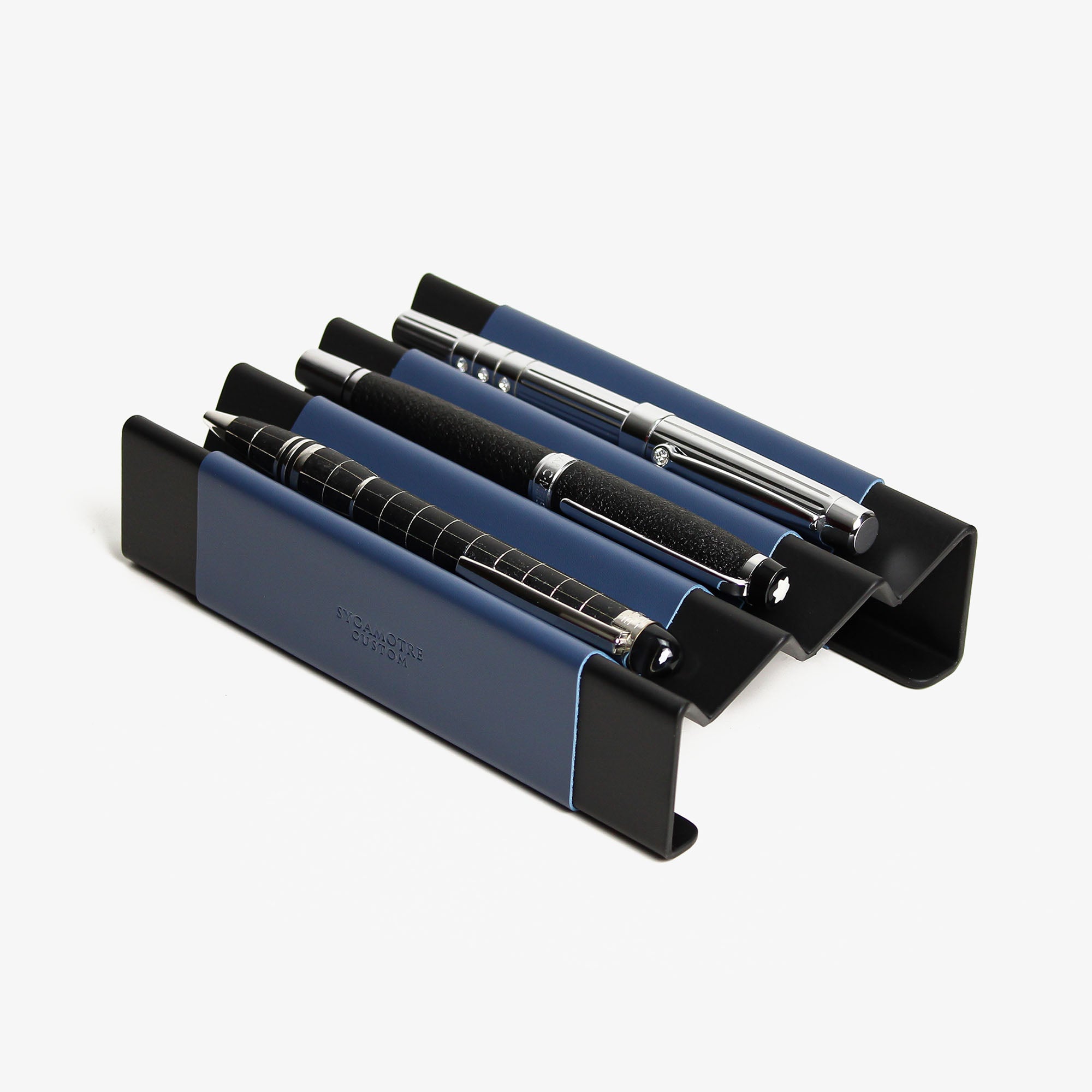 Side angle showing the depth and detail of the ocean-blue pen tray