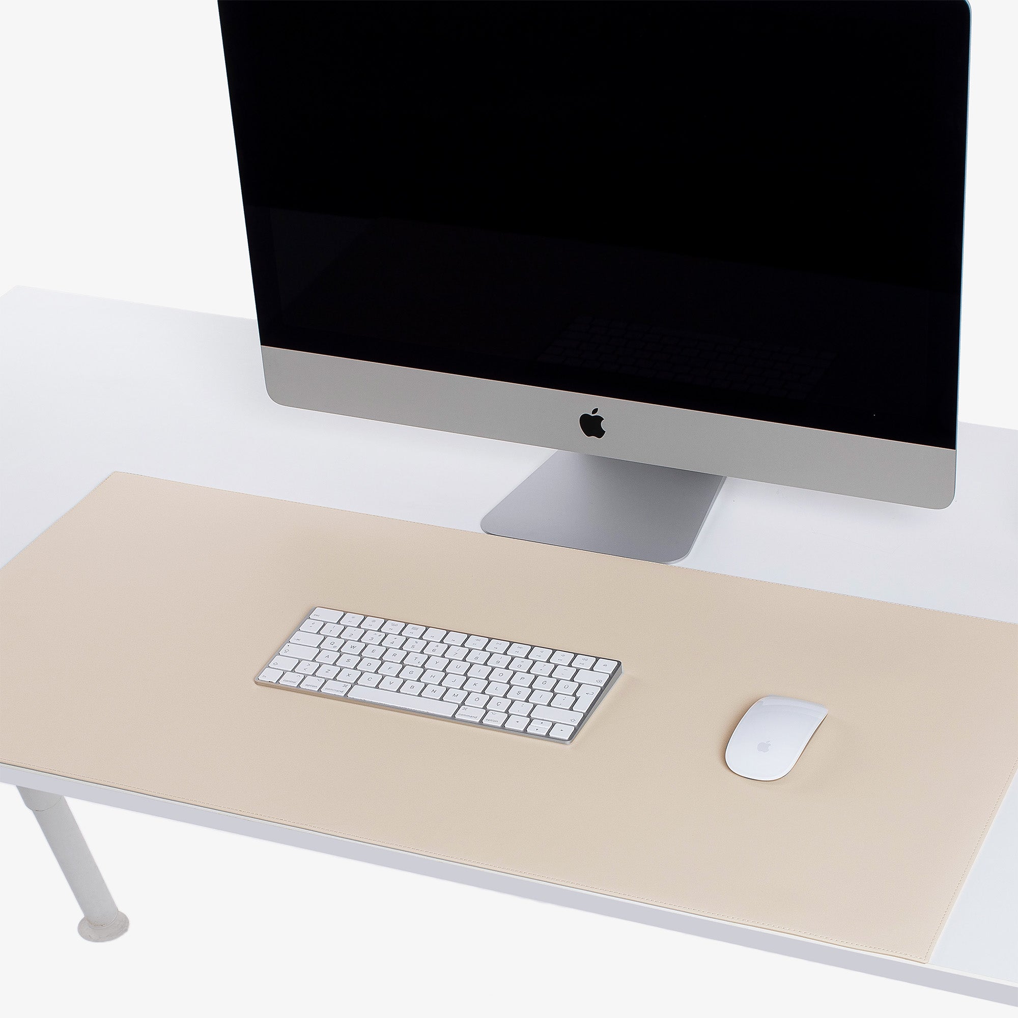 Beige Leather desk mat on the desk