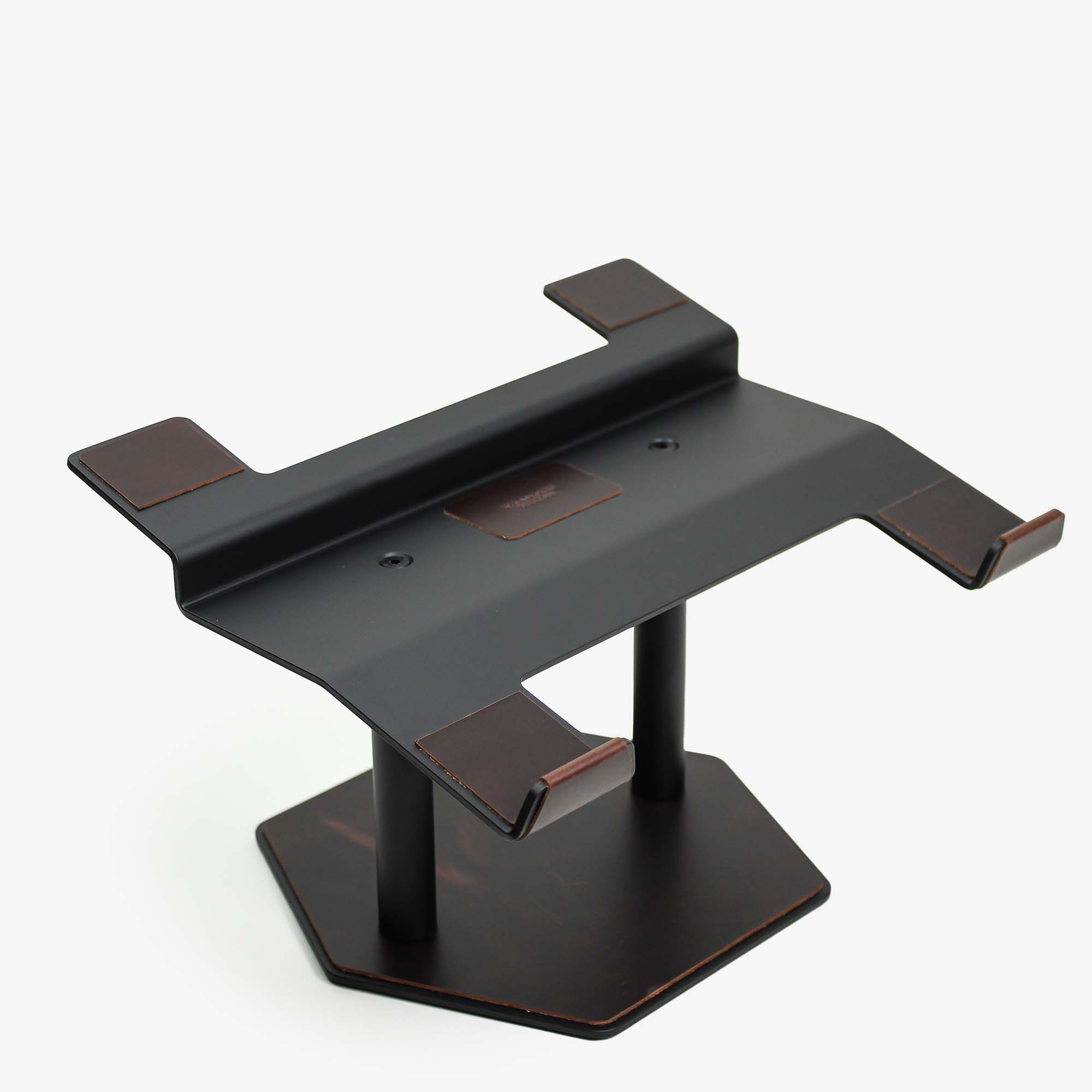 Front view of the crazy-chestnut leather and aluminum laptop riser on a desk
