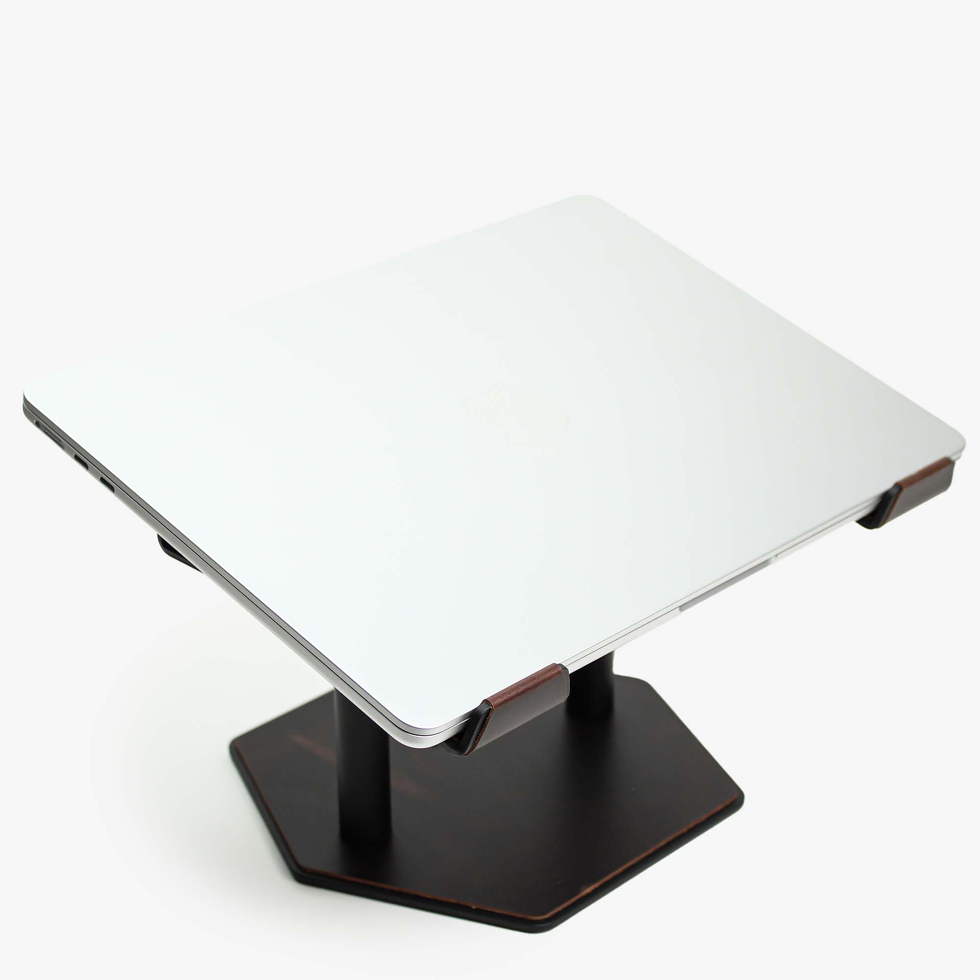 Side angle showing the ergonomic tilt of the crazy-chestnut laptop stand