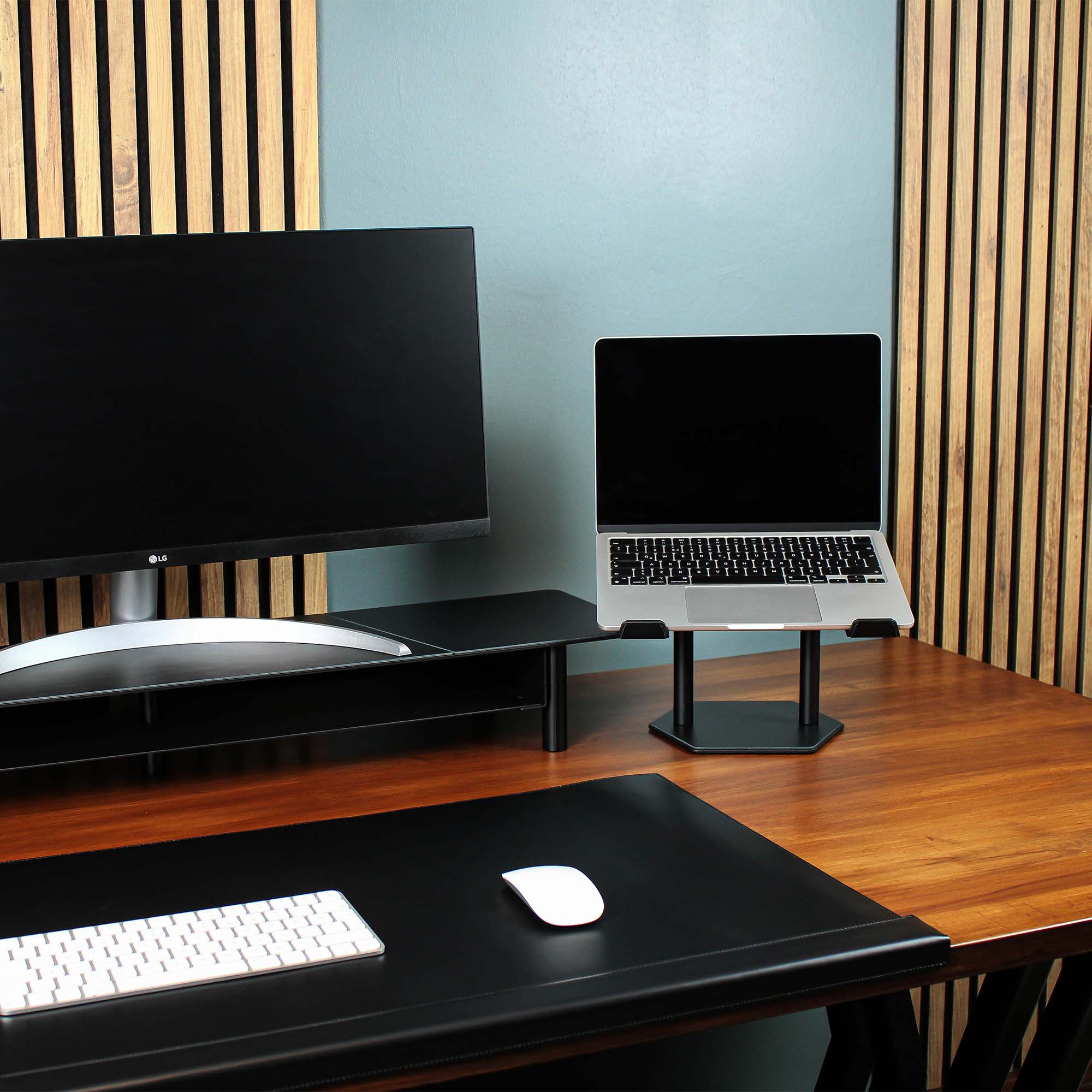 Lifestyle setup featuring the black laptop riser with matching accessories