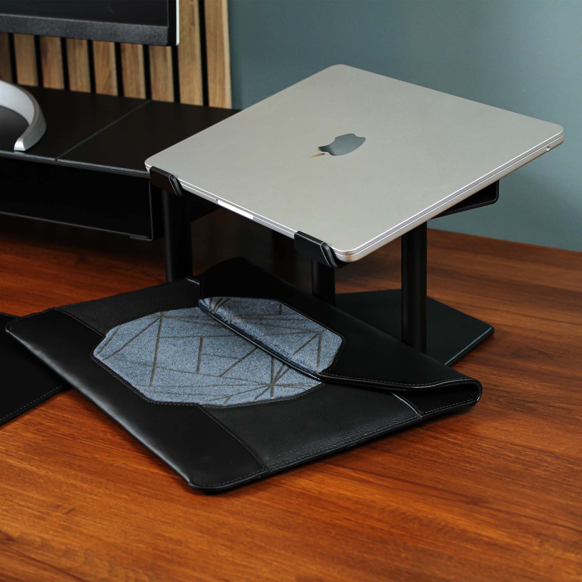 Lifestyle setup featuring the black laptop riser with matching accessories