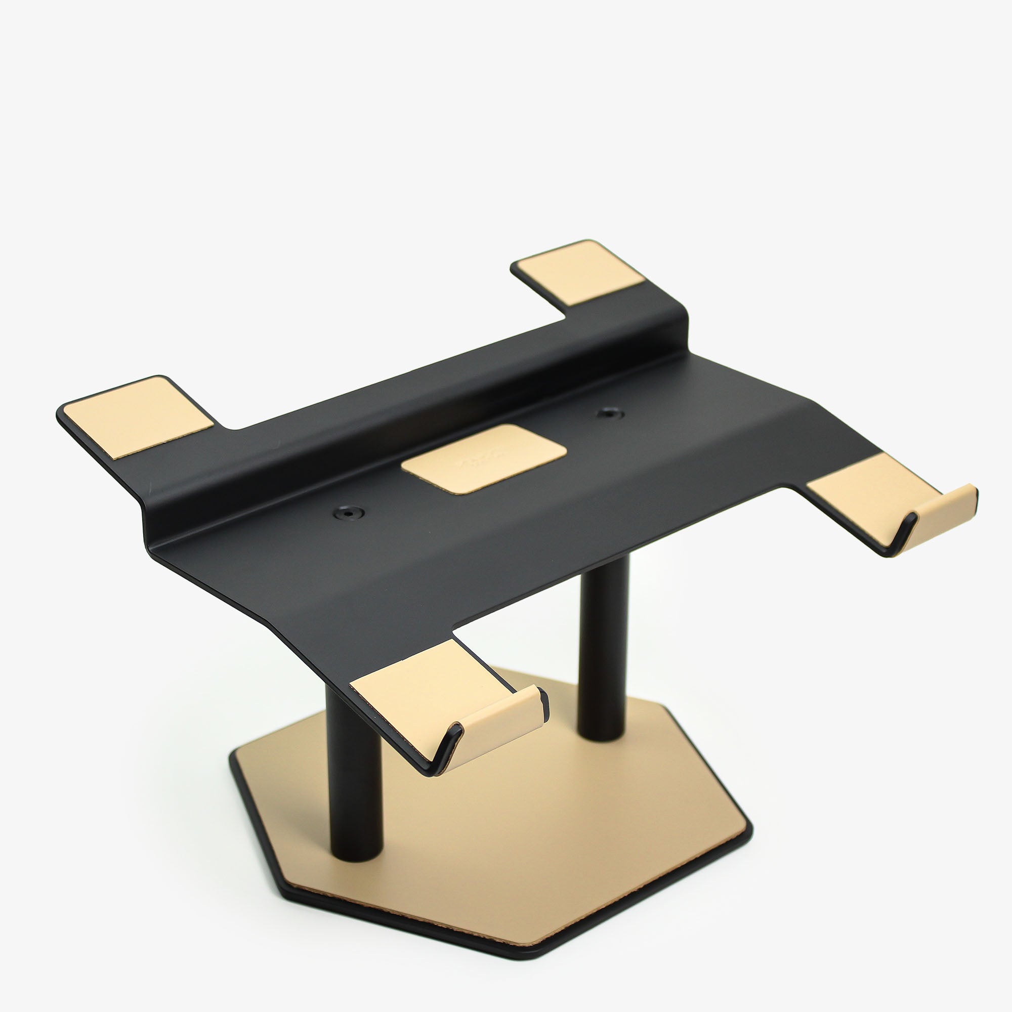 Front view of the latte leather and aluminum laptop riser on a desk