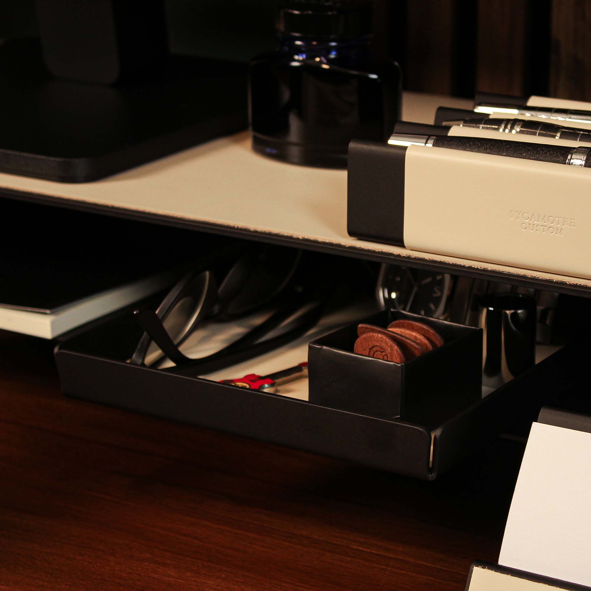 Group photo showing the full metal and leather collection with the beige valet tray