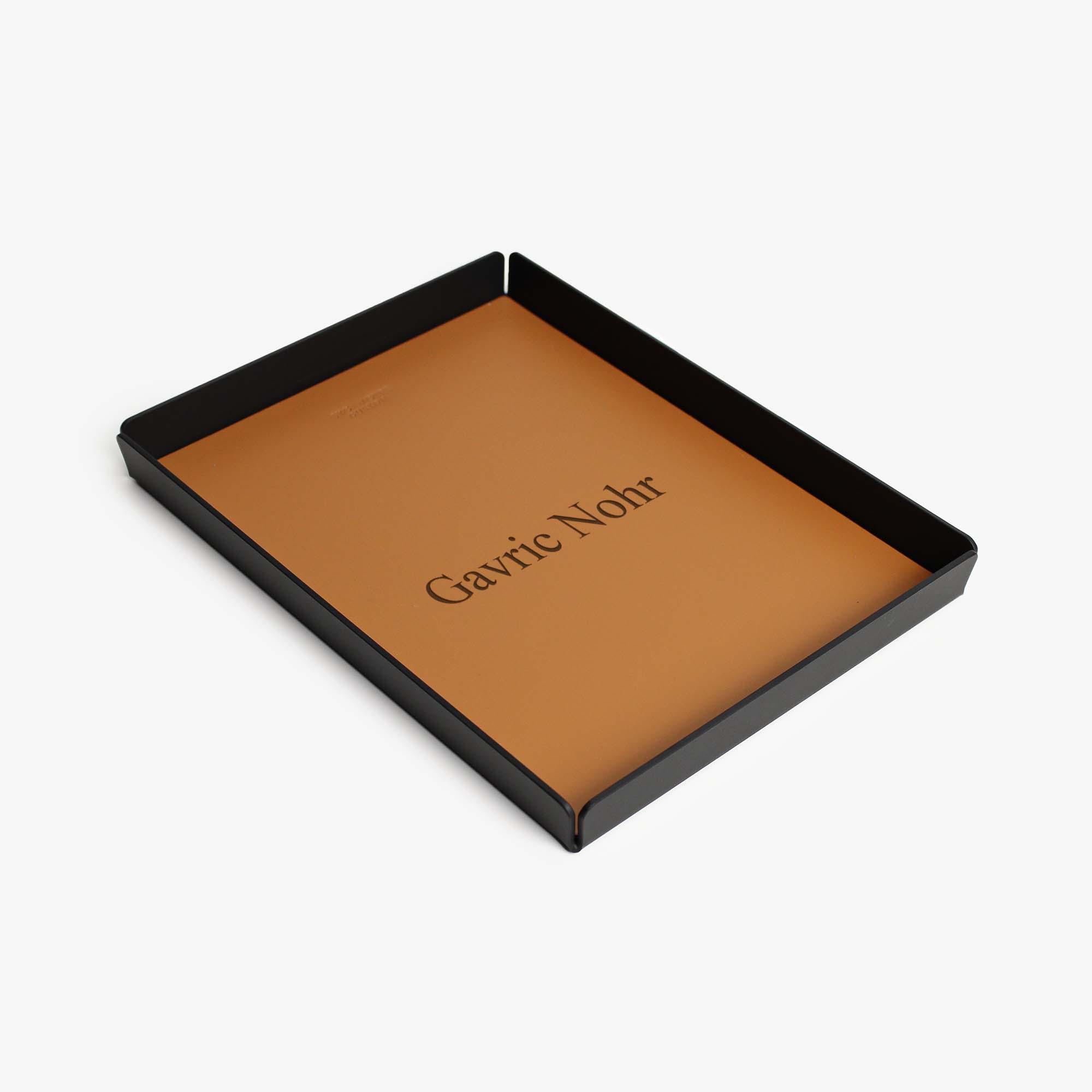 Side angle showing the sleek edges of the cognac valet tray