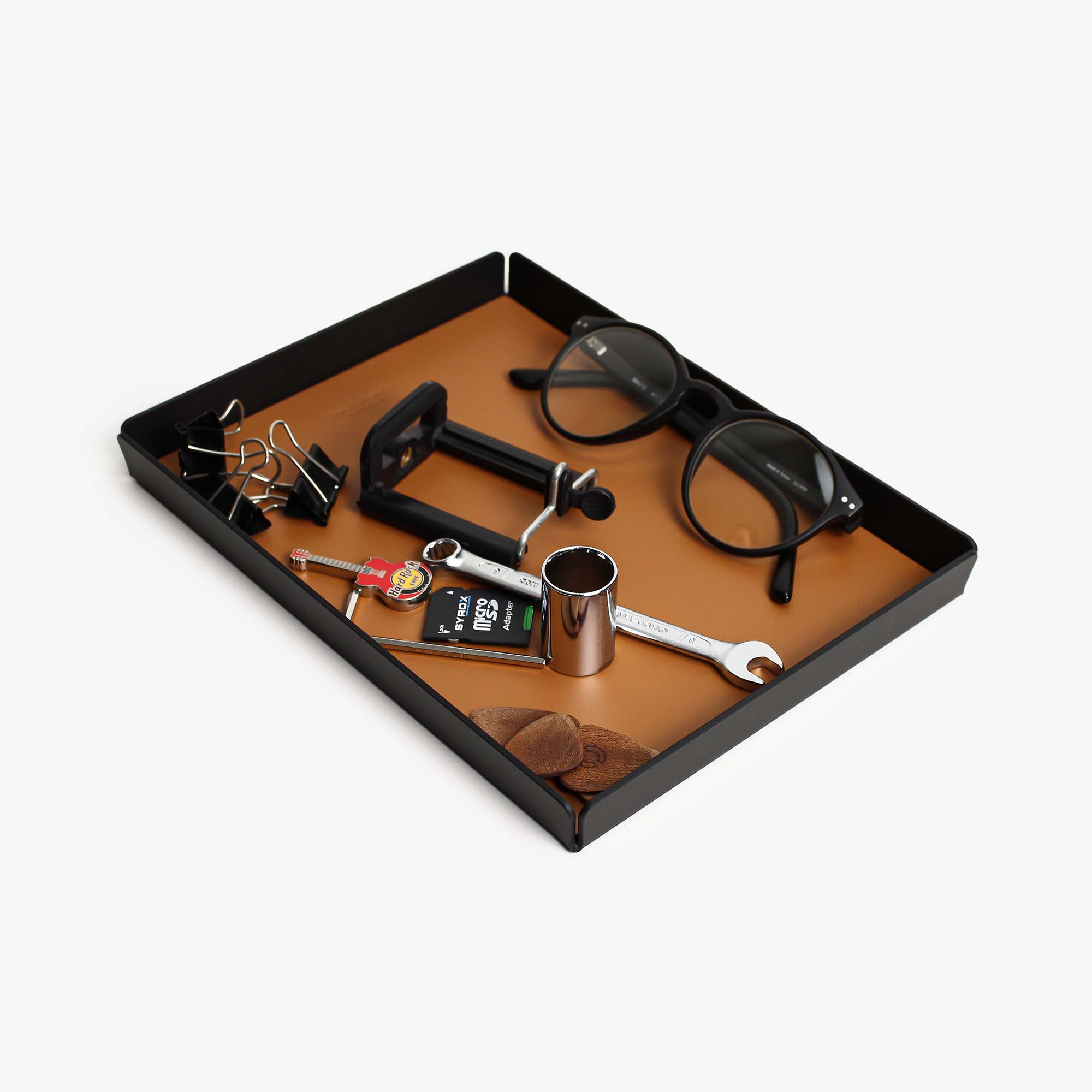 Side angle showing the sleek edges of the cognac valet tray