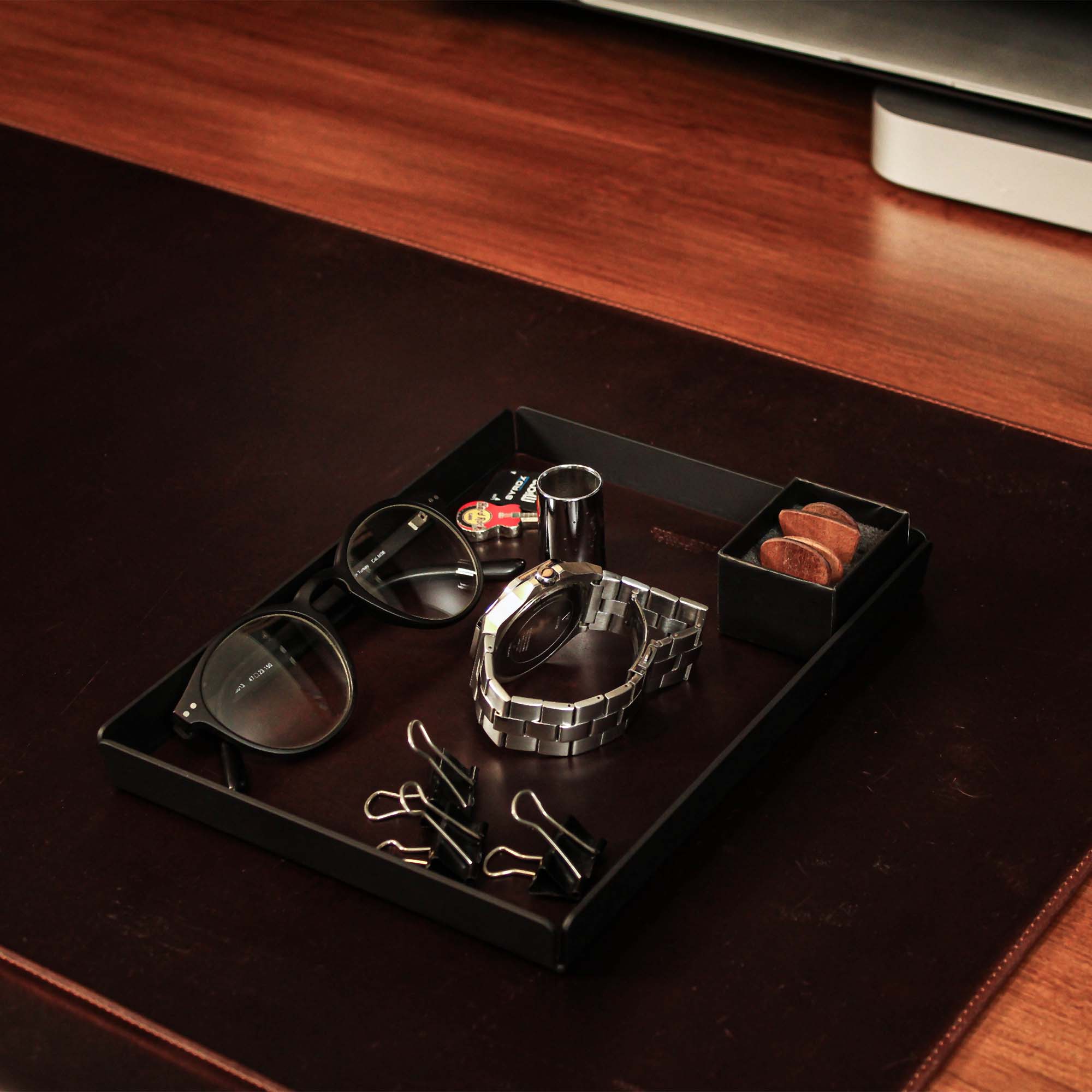 Minimalist desk setup featuring the crazy-chestnut valet tray with accessories