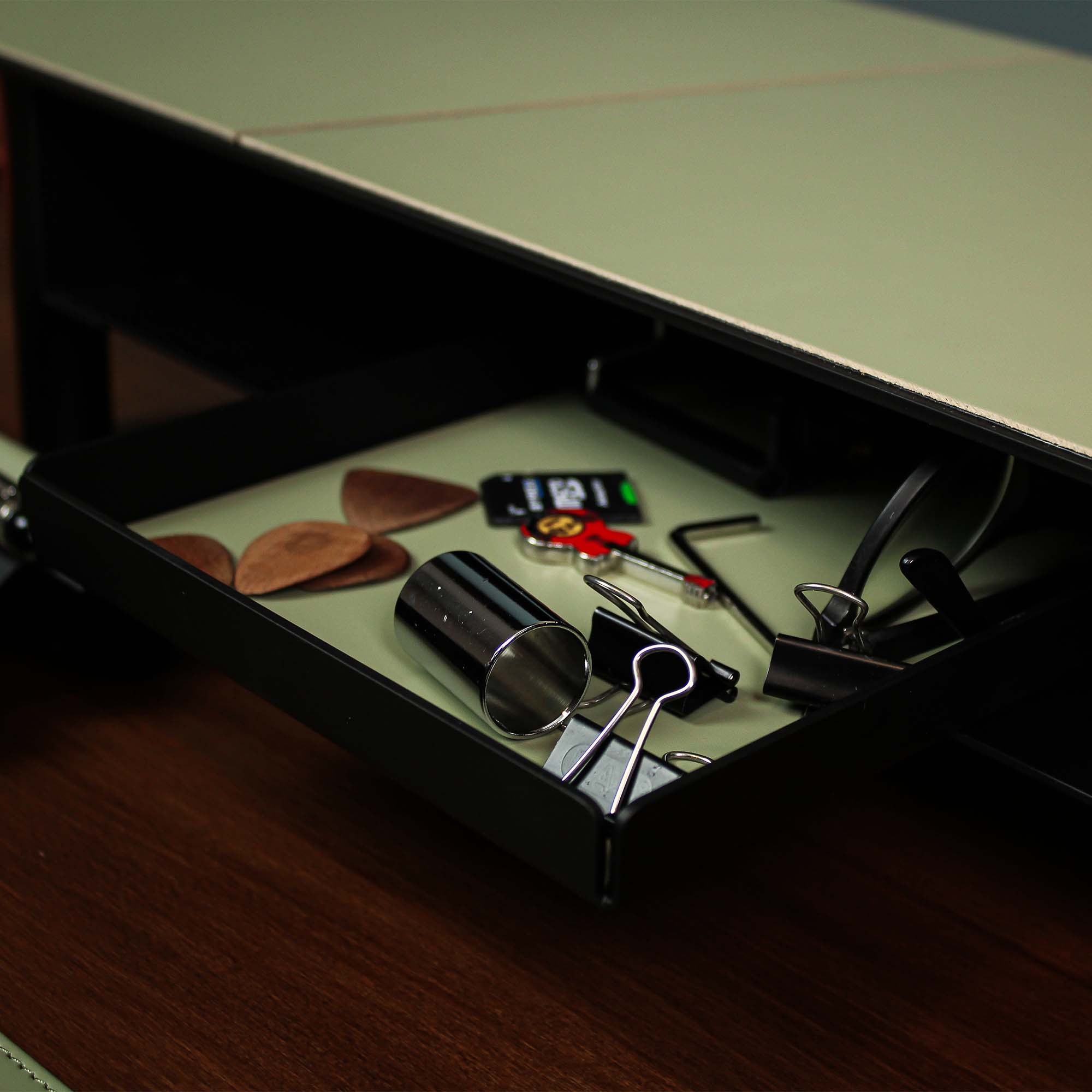 Minimalist desk setup featuring the sage-green valet tray with accessories