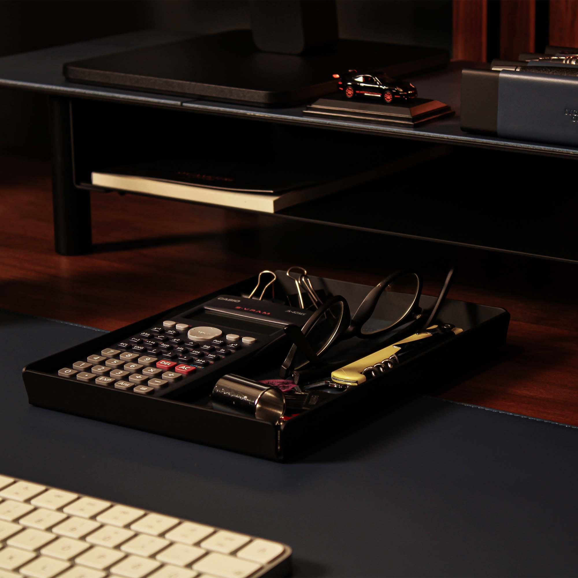 Minimalist desk setup featuring the ocean-blue valet tray with accessories