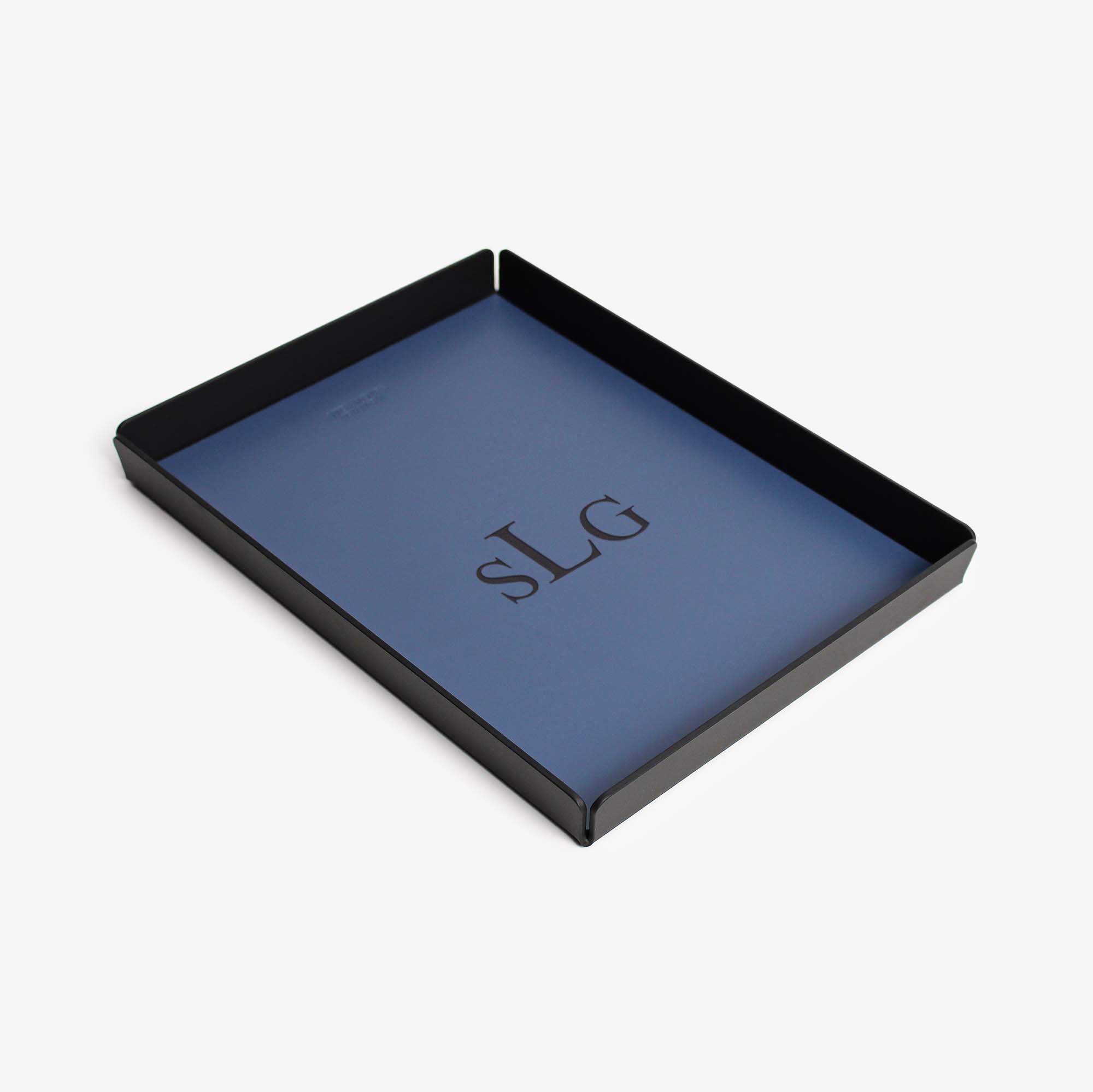 Side angle showing the sleek edges of the ocean-blue valet tray