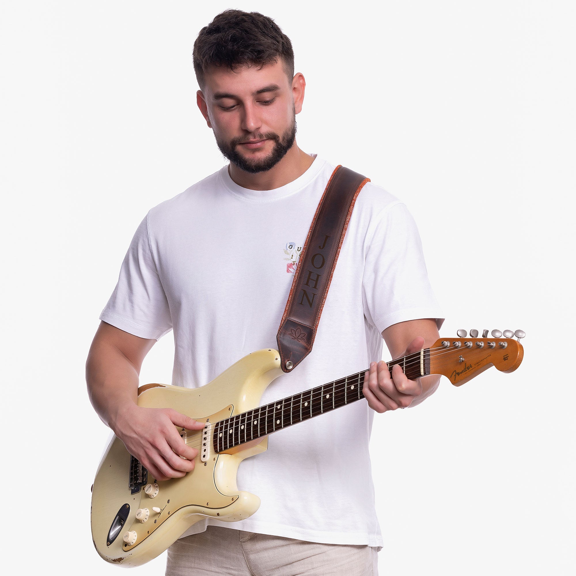 Brown Padded Leather guitar strap on model with personalization