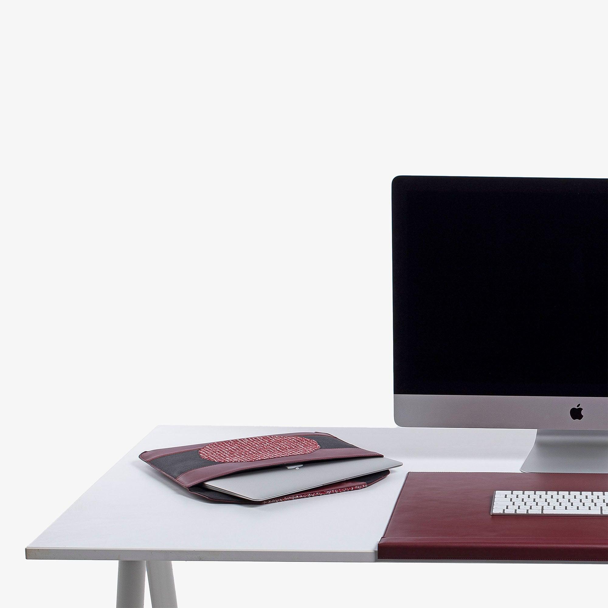 Personalized red leather MacBook sleeve on the desk