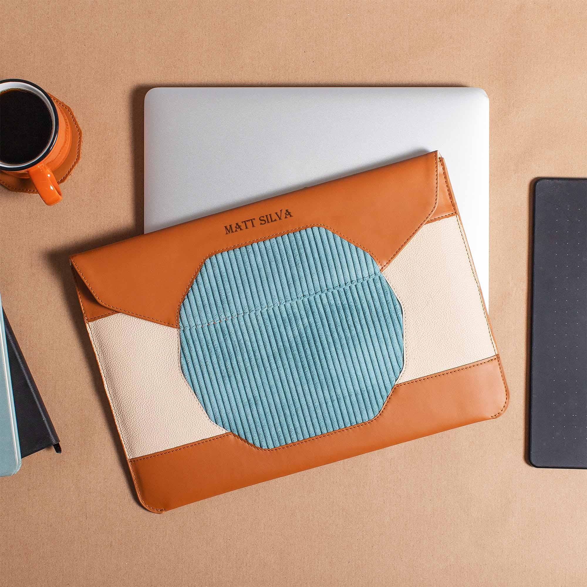 Custom tan leather MacBook sleeve with personalization options