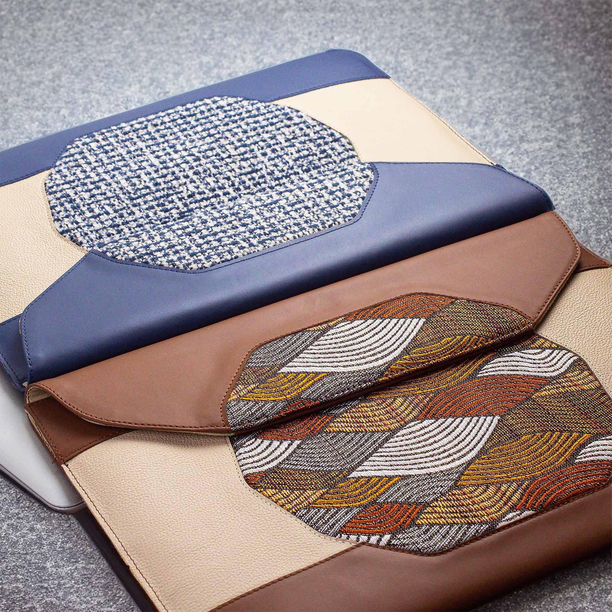 Custom brown leather MacBook sleeve on the desk