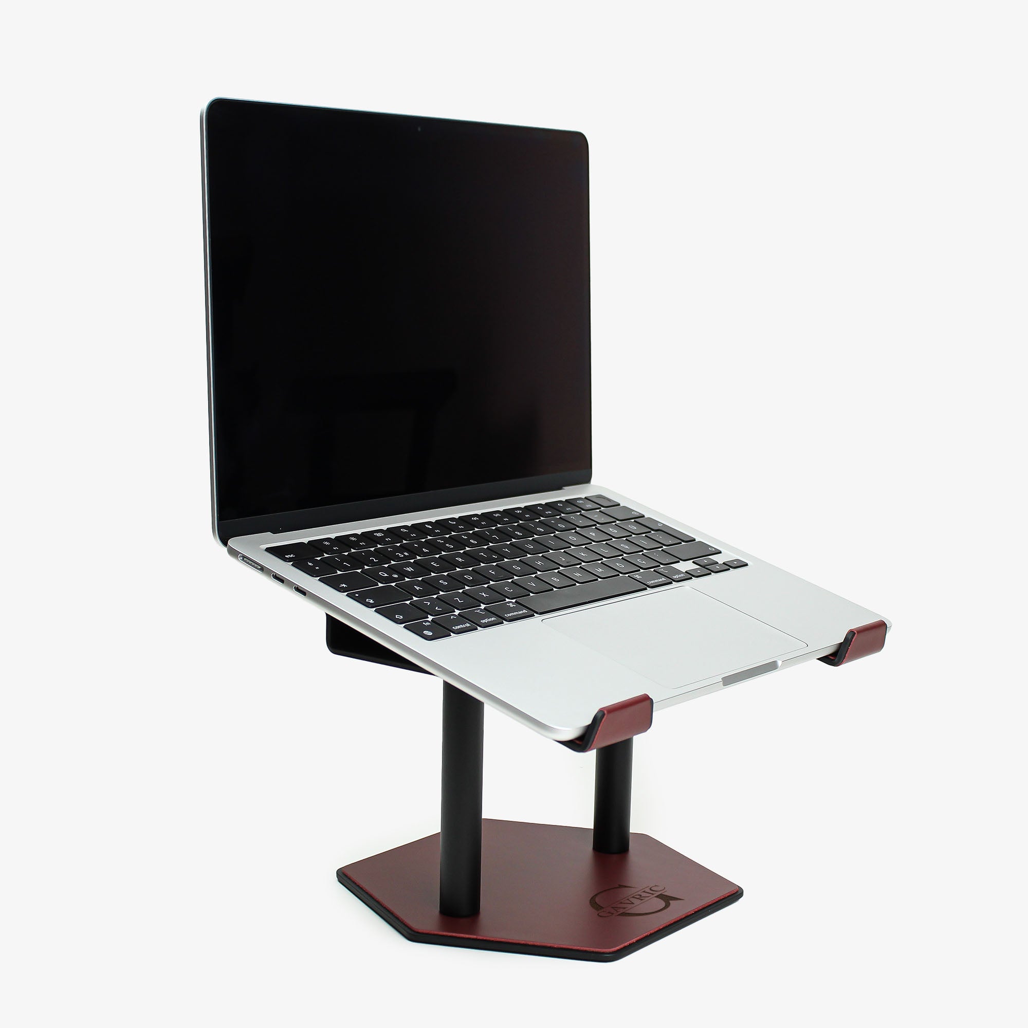 Side angle showing the ergonomic tilt of the burgundy laptop stand with macbook