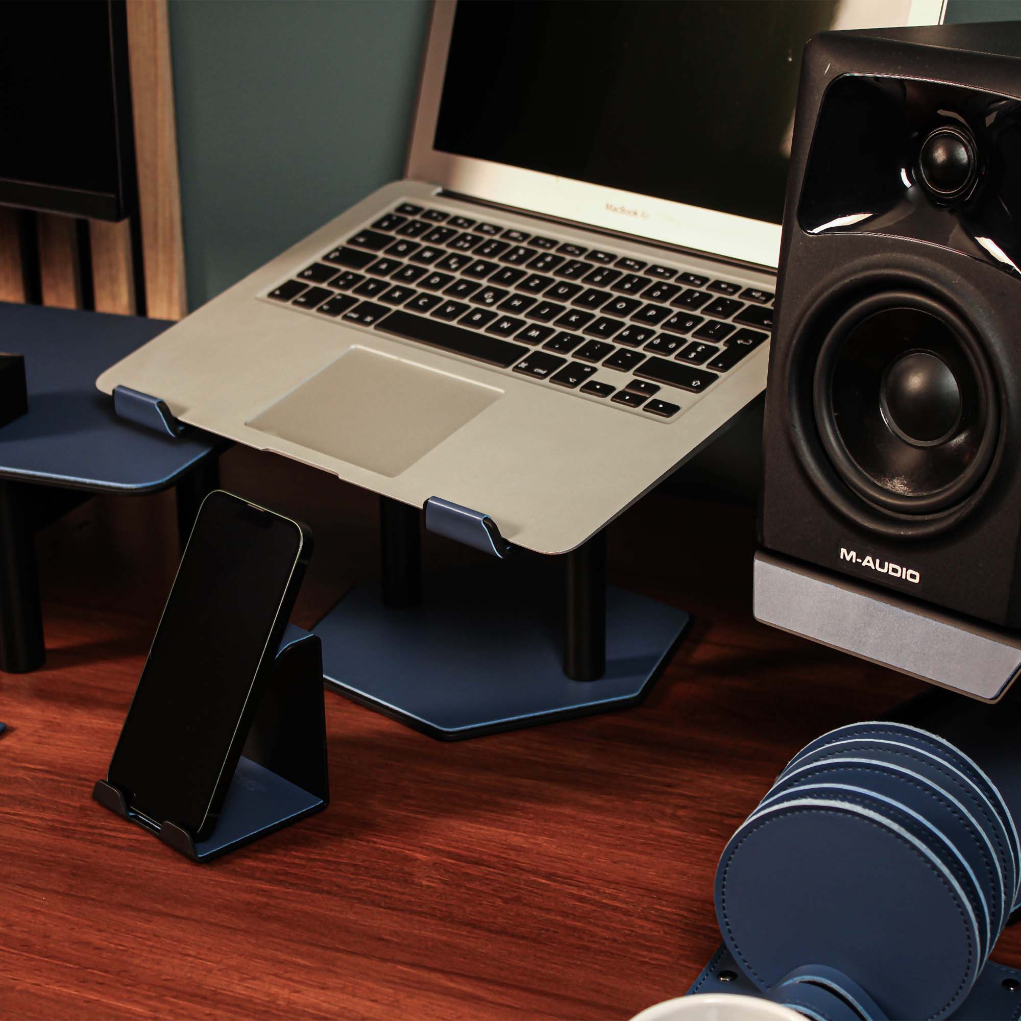 Close-up of the padded base of the ocean-blue laptop riser for desk protection