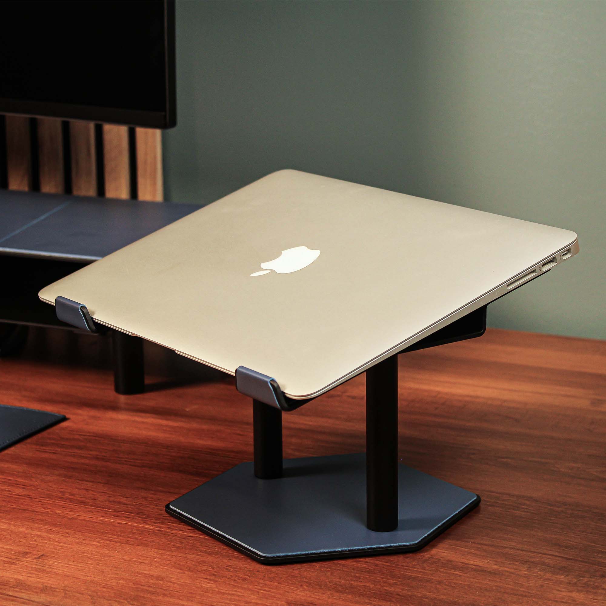 Lifestyle setup featuring the ocean-blue laptop riser with matching accessories