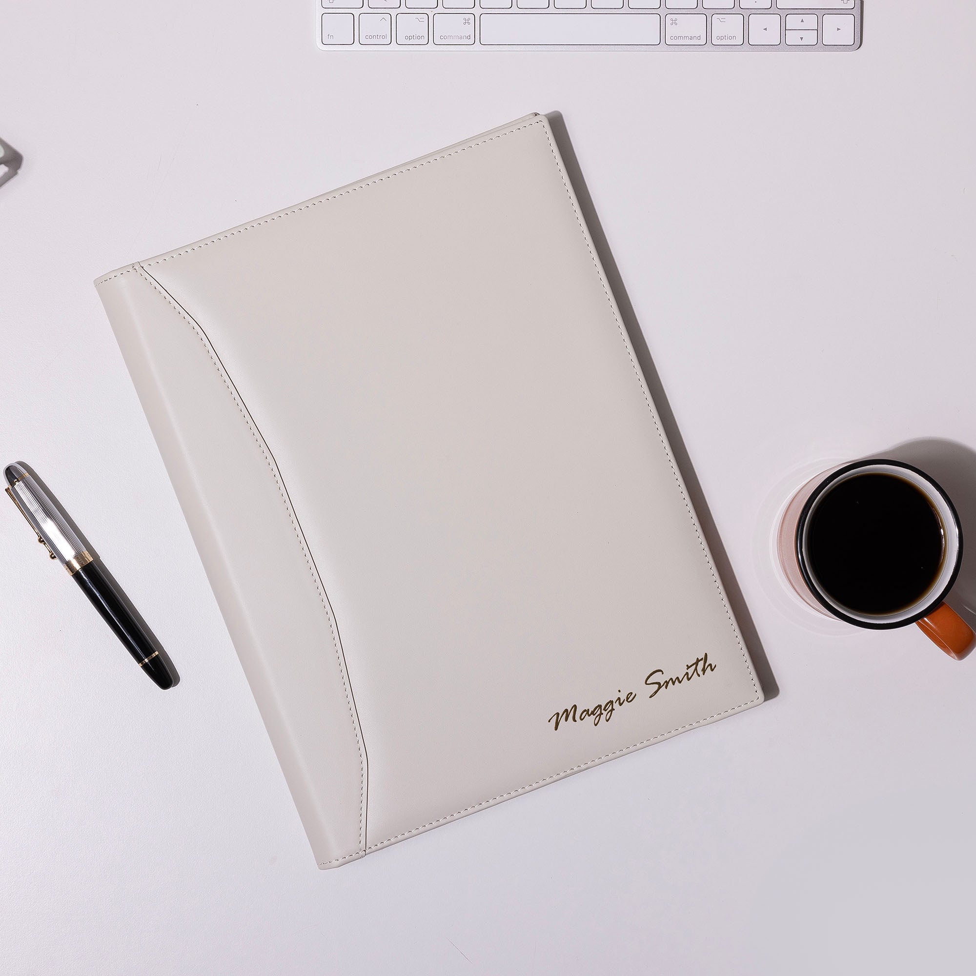 personalized White Leather A4 padfolio on the desk