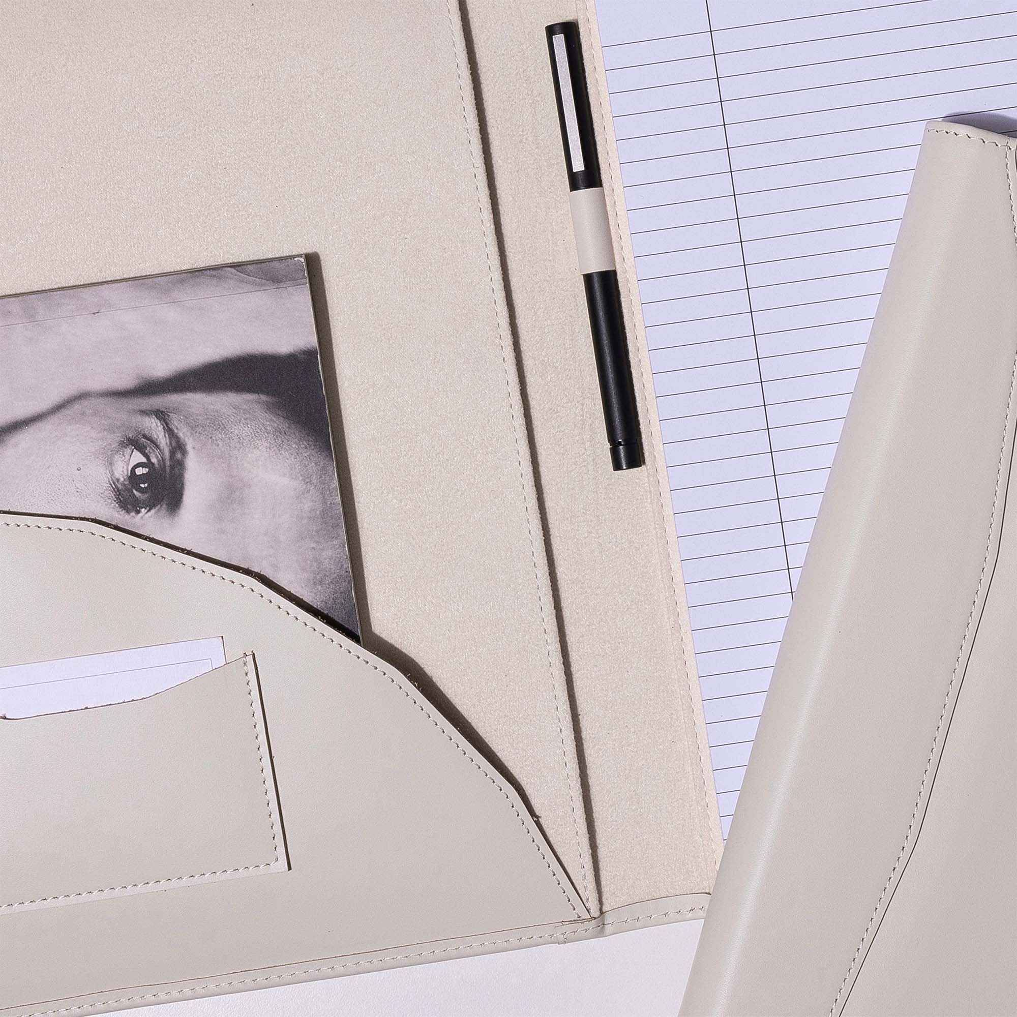 Inside of White Leather A4 padfolio on the desk