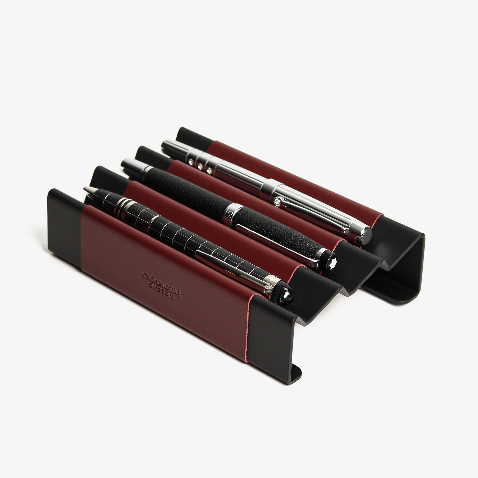 Side angle showing the depth and detail of the burgundy pen tray