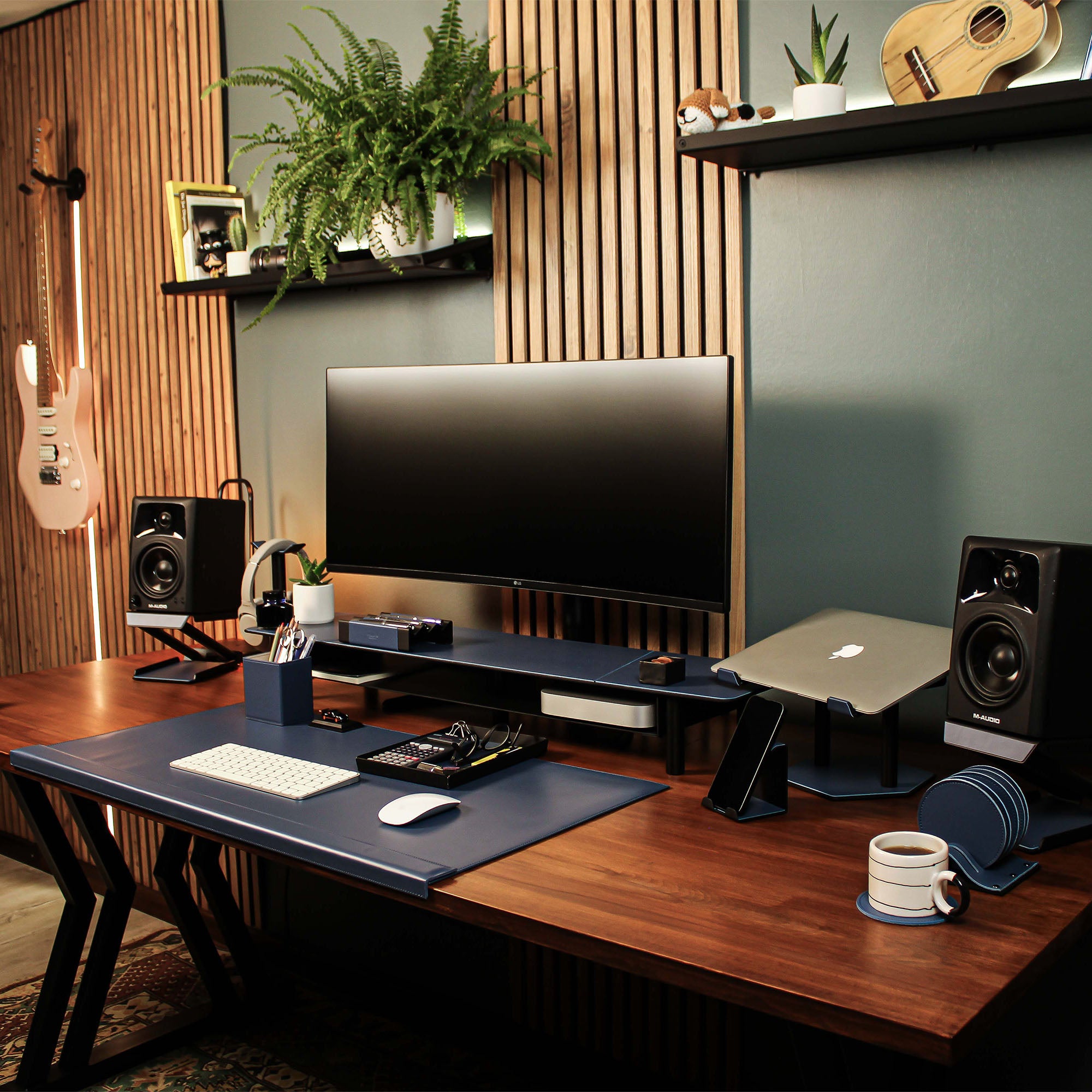 Group photo showing the full metal and leather collection with the ocean-blue pen tray