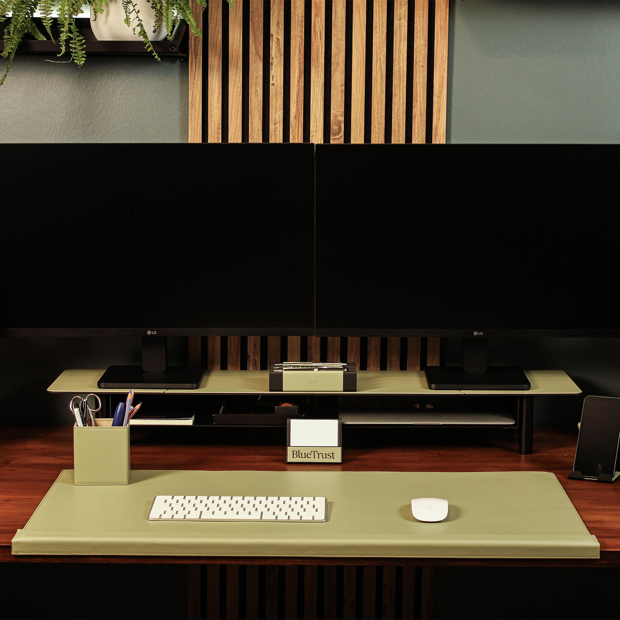 Group photo showing the full metal and leather collection with the sage-green pen tray