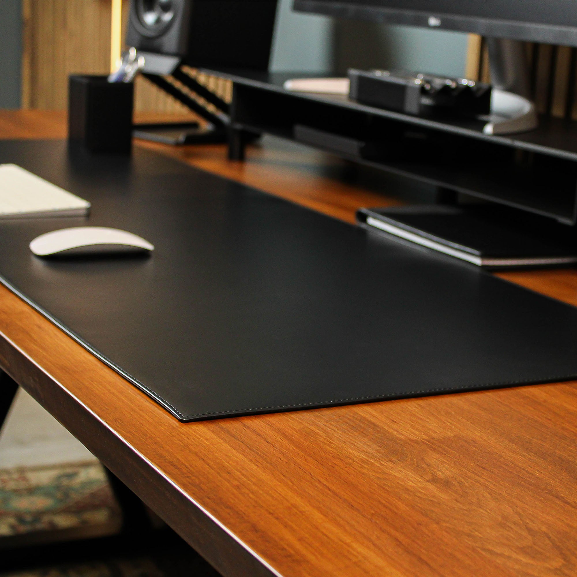 Black Leather desk mat on the desk with mouse