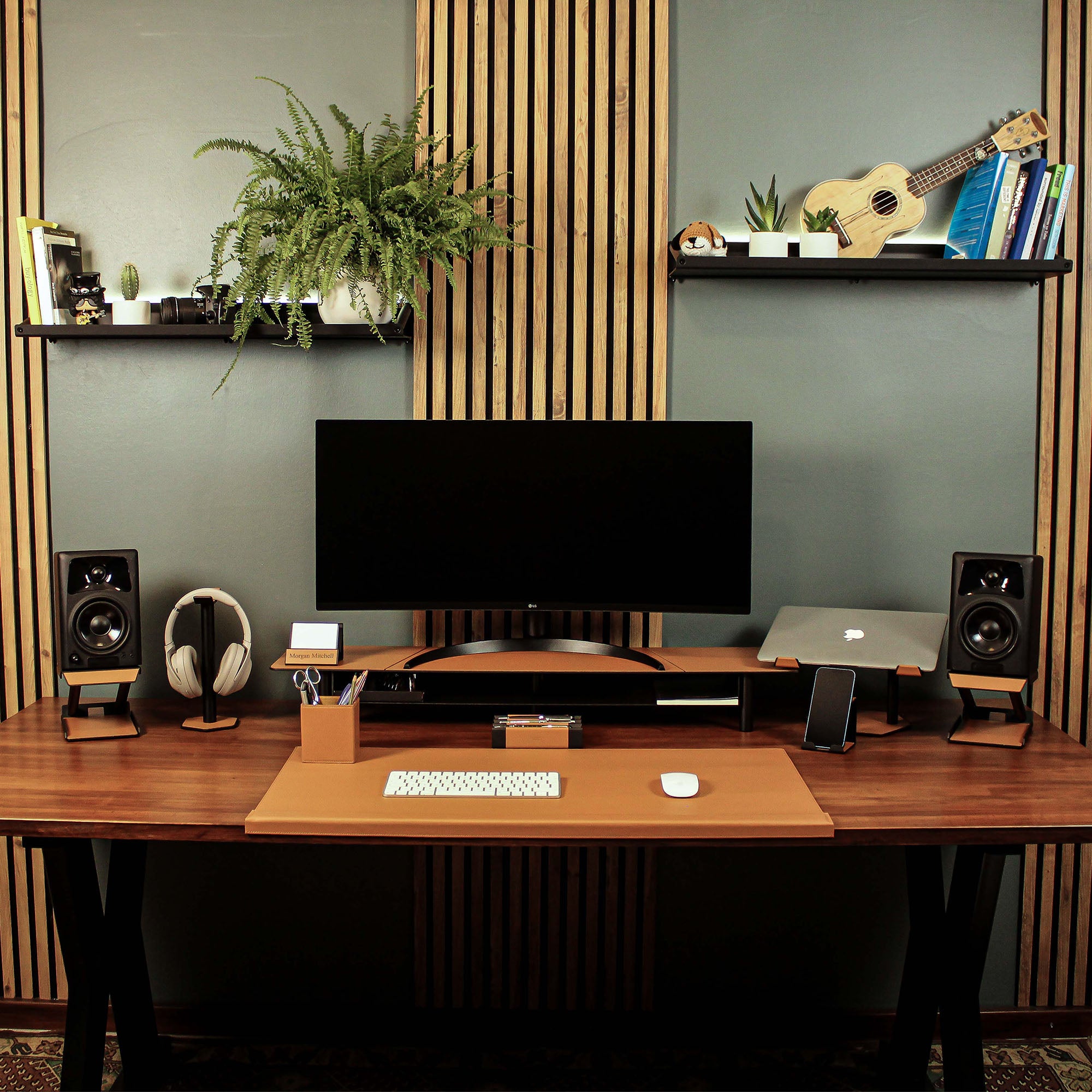 Lifestyle setup featuring the cognac laptop riser with matching accessories