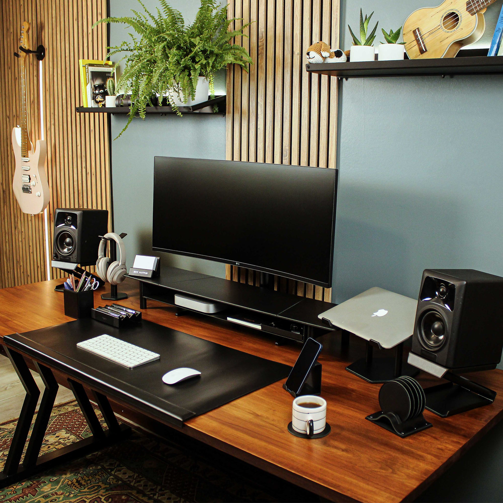 Lifestyle setup featuring the black laptop riser with matching accessories