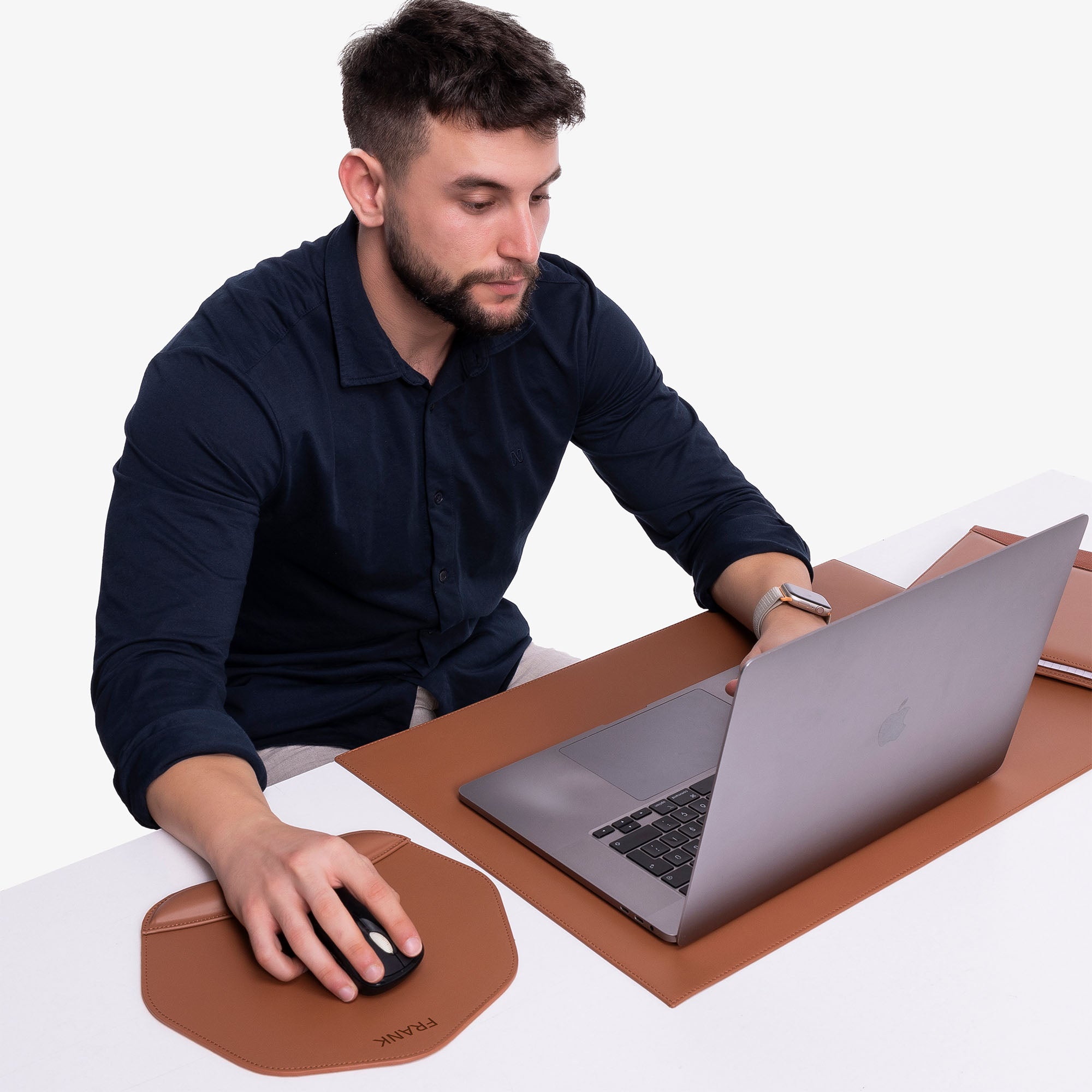 Human using Personalized Brown Mouse pad with wrist support under magic mouse