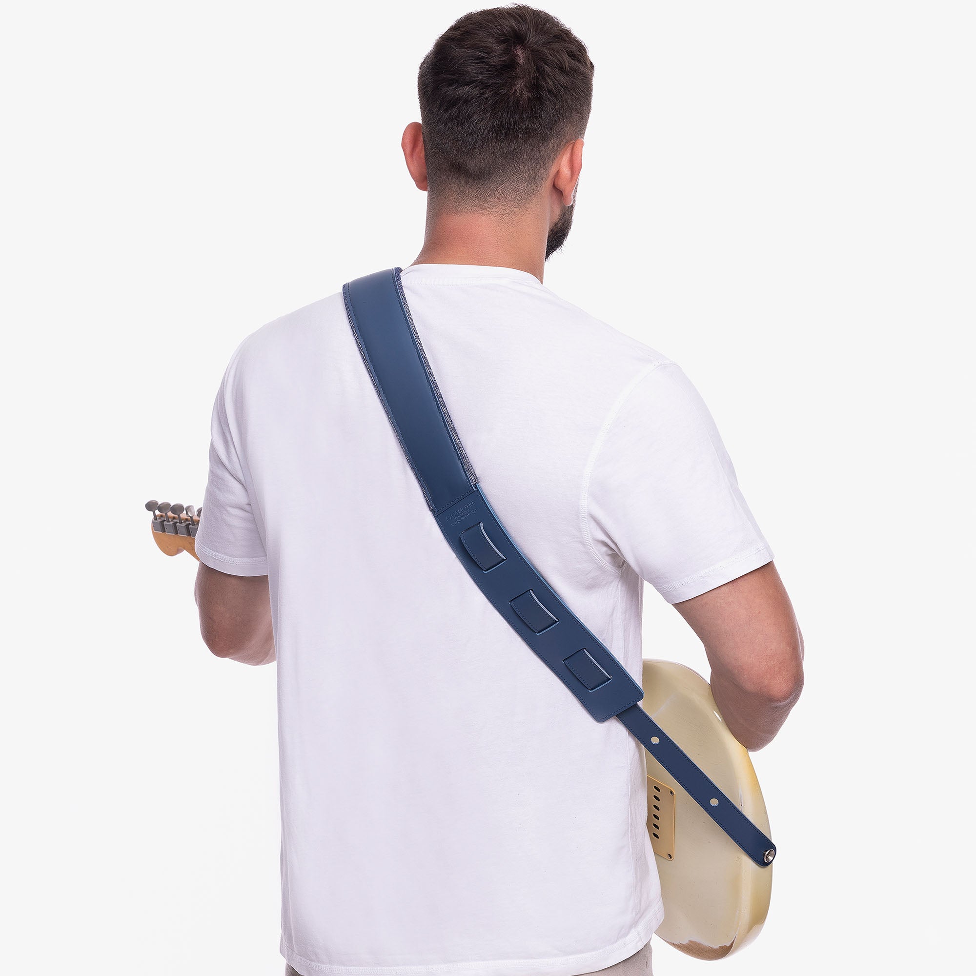 Blue Padded Leather guitar strap on model wearing custom strap