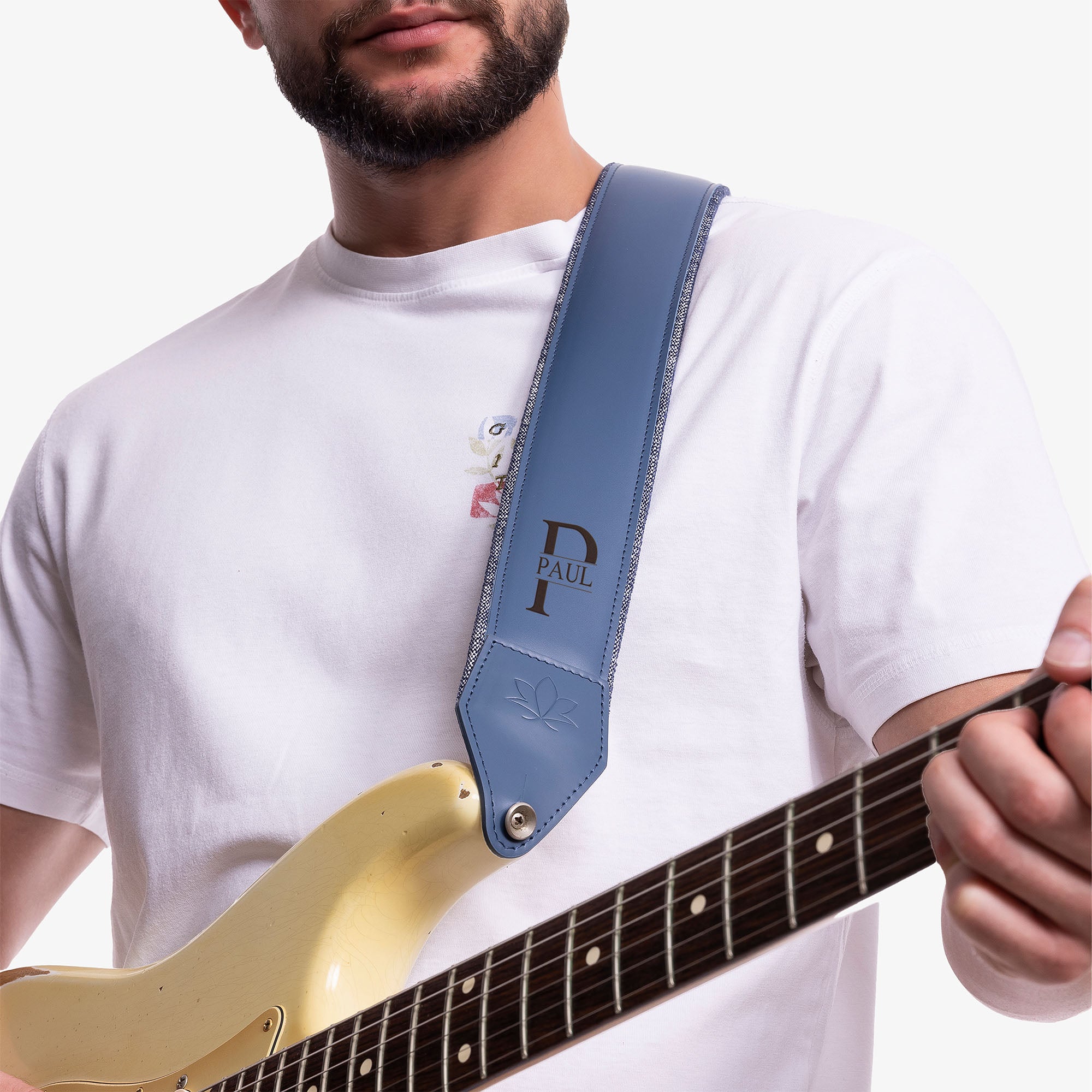 Blue Padded Leather guitar strap on model with personalization