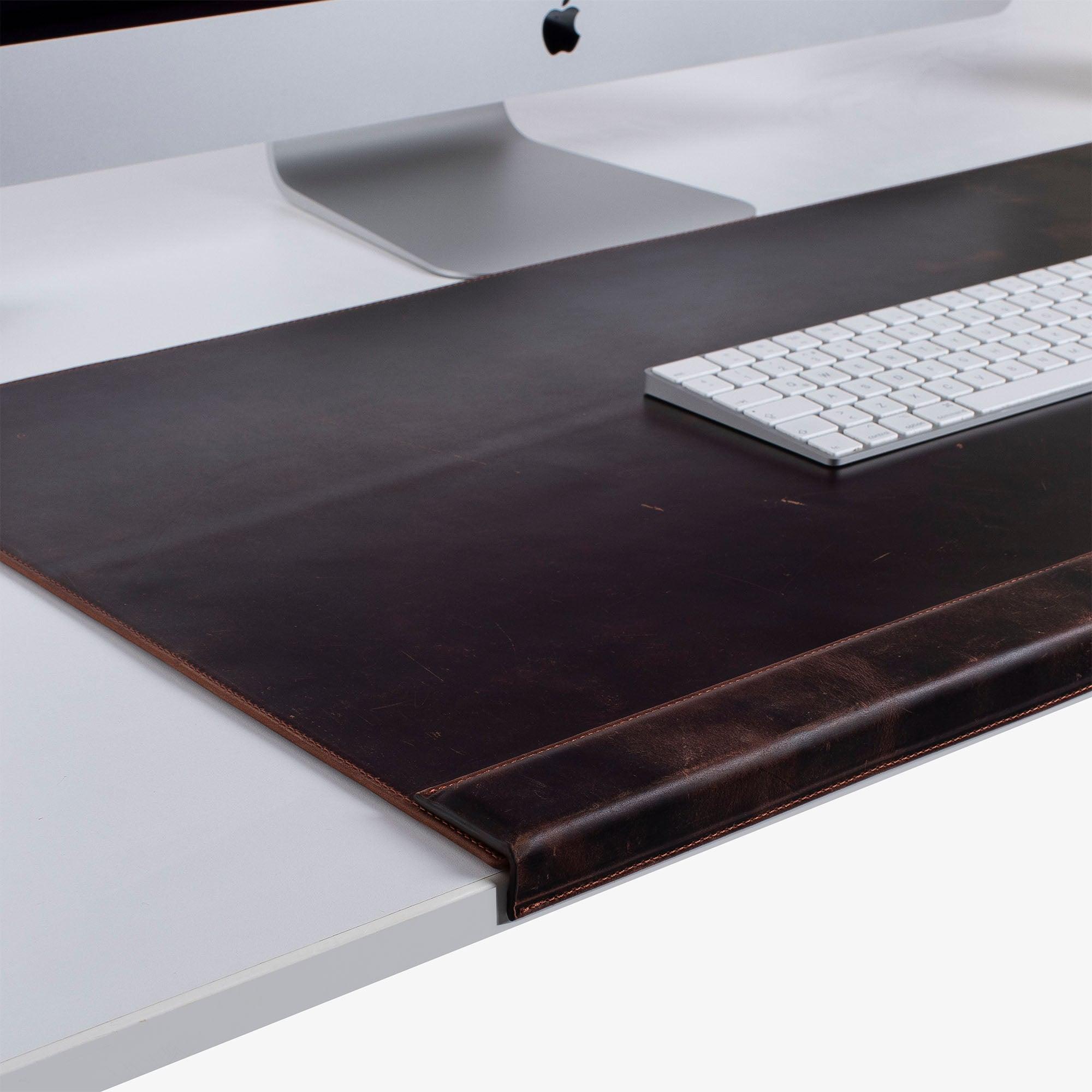 Leather desk mat on the desk 