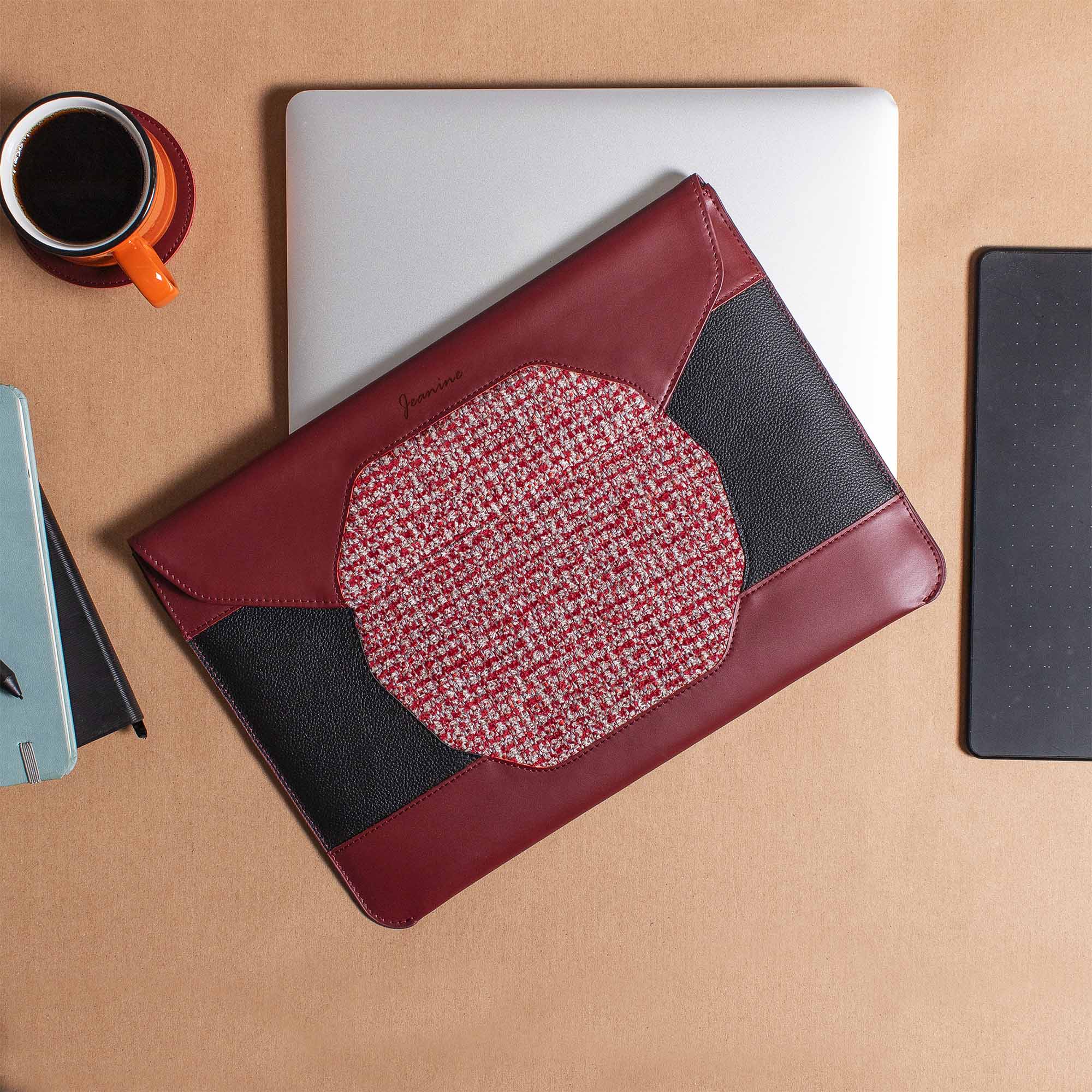 Personalized red leather MacBook sleeve on the desk 