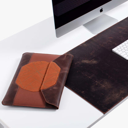 Custom brown distressed leather MacBook sleeve with padded design  