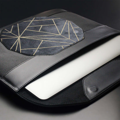 Personalized black leather MacBook sleeve on the desk 