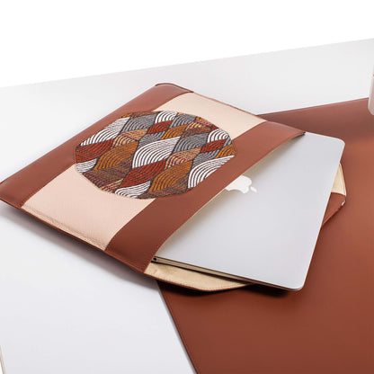 Personalized brown leather MacBook sleeve on the desk 