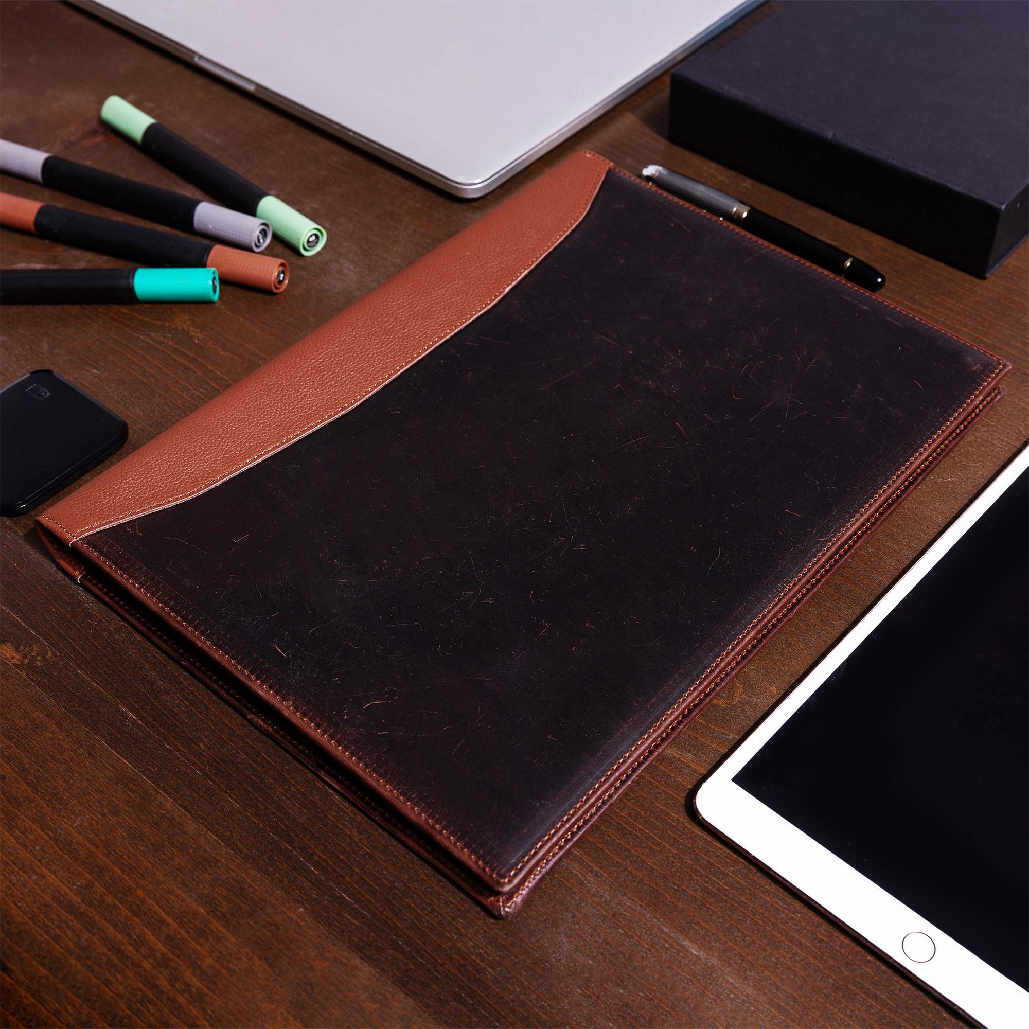 Distressed Brown Leather A4 padfolio on the desk 