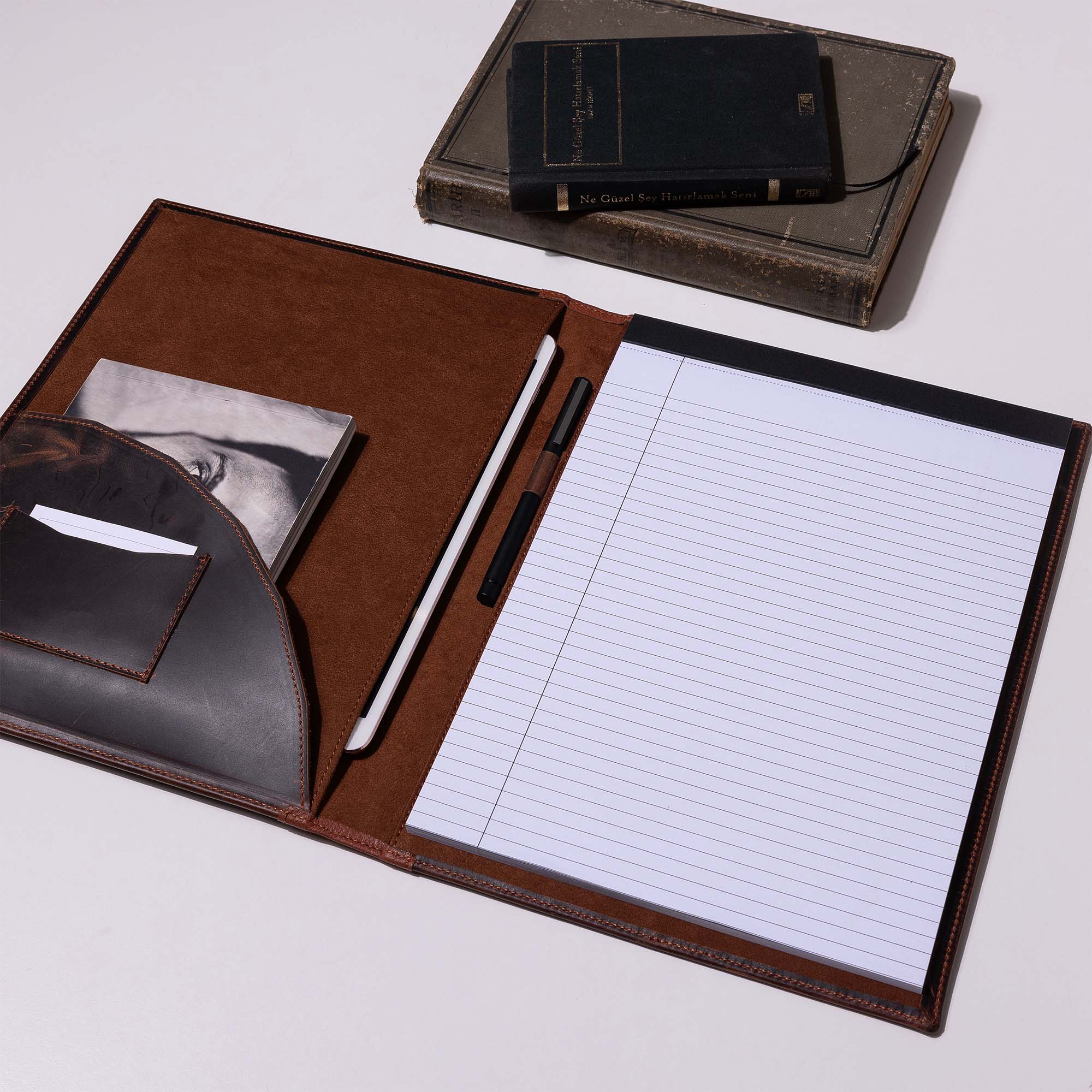 Inside of Distressed Brown Leather A4 padfolio on the desk 